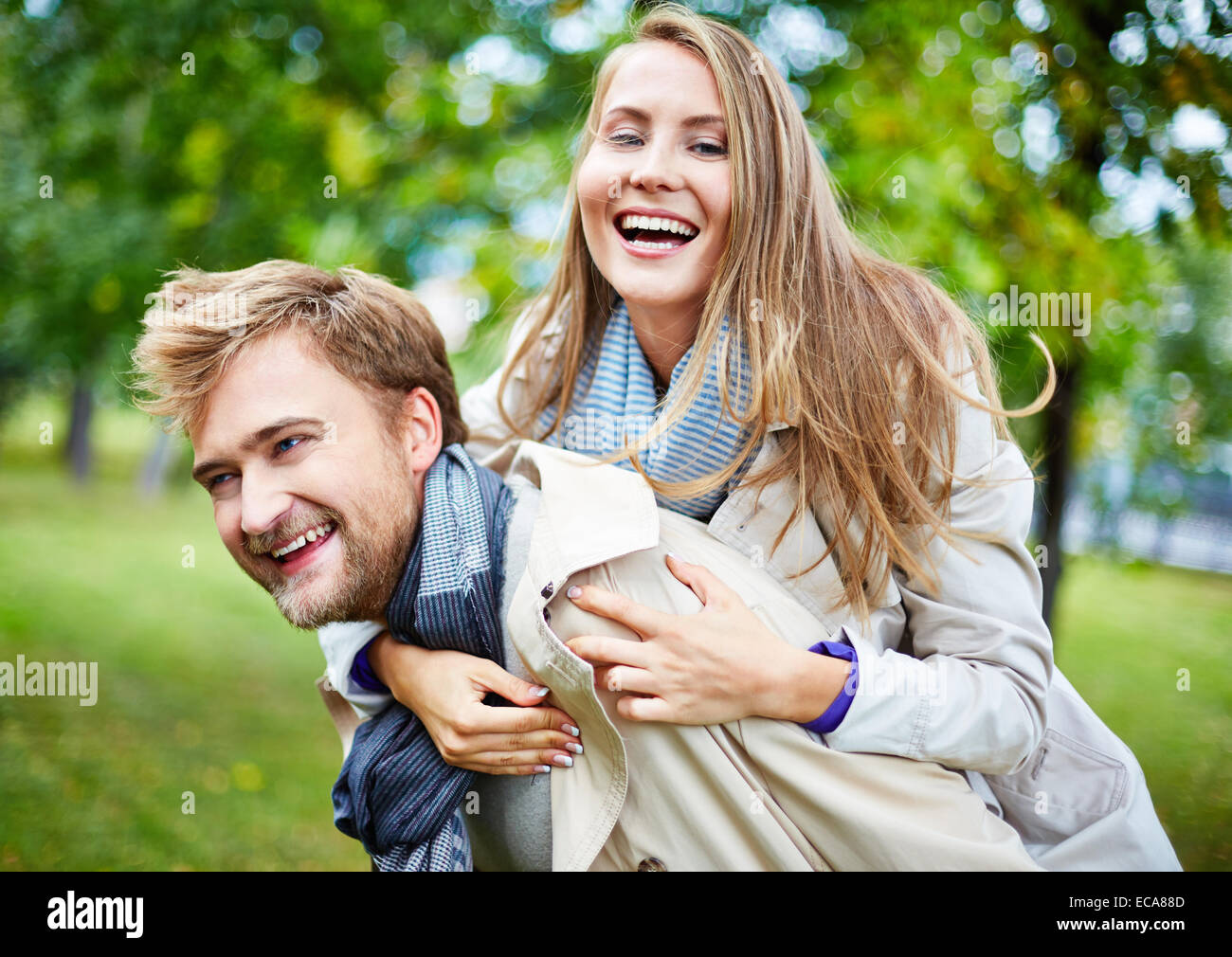Young couple having fun in park hi-res stock photography and images - Alamy