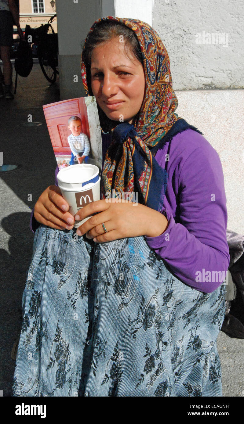 A Roma woman begging in Salzburg, Austria. Stock Photo