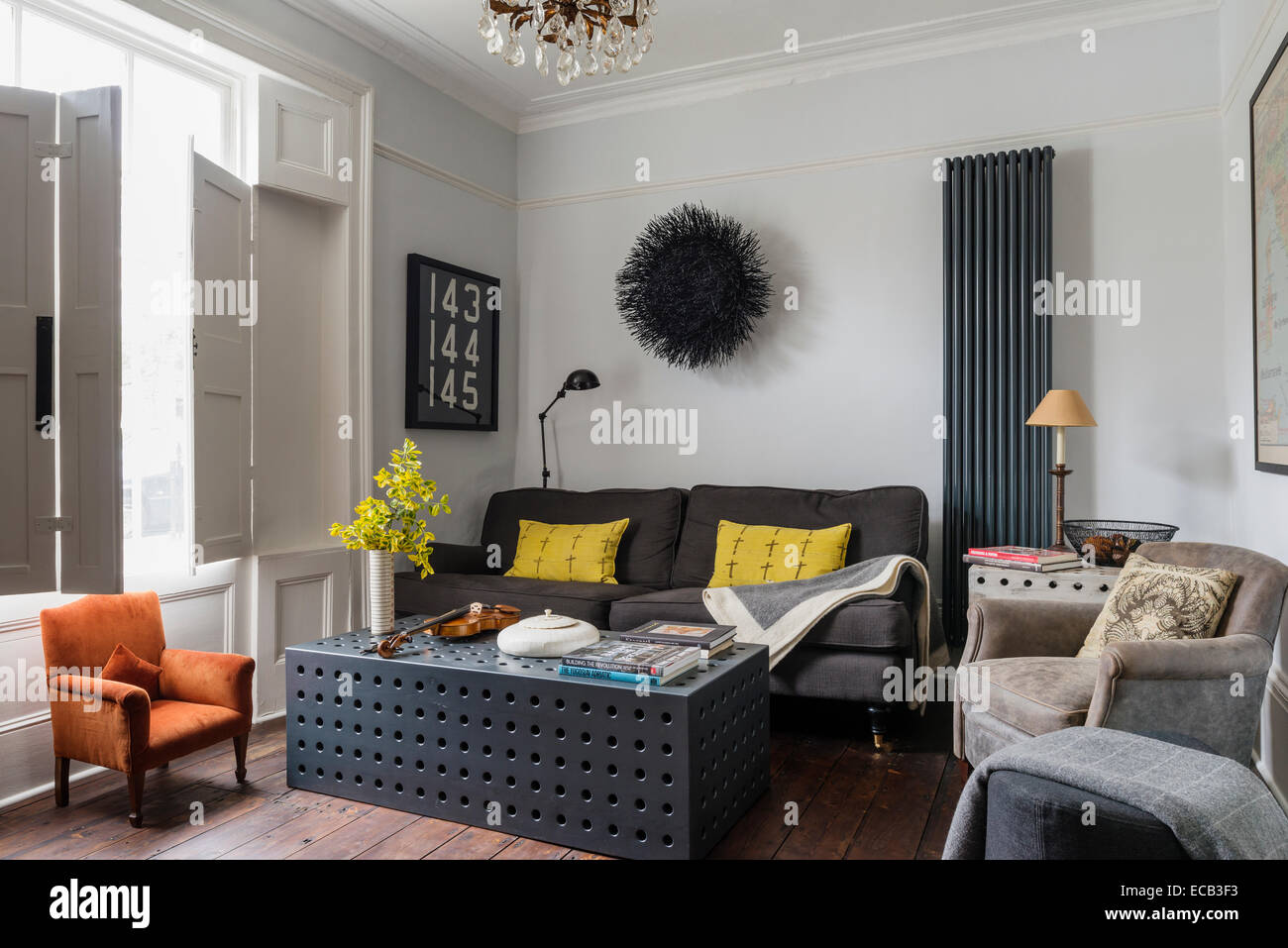 Stylish sitting room with original window shutters. The coffee table cam from Selina van der Geest Stock Photo