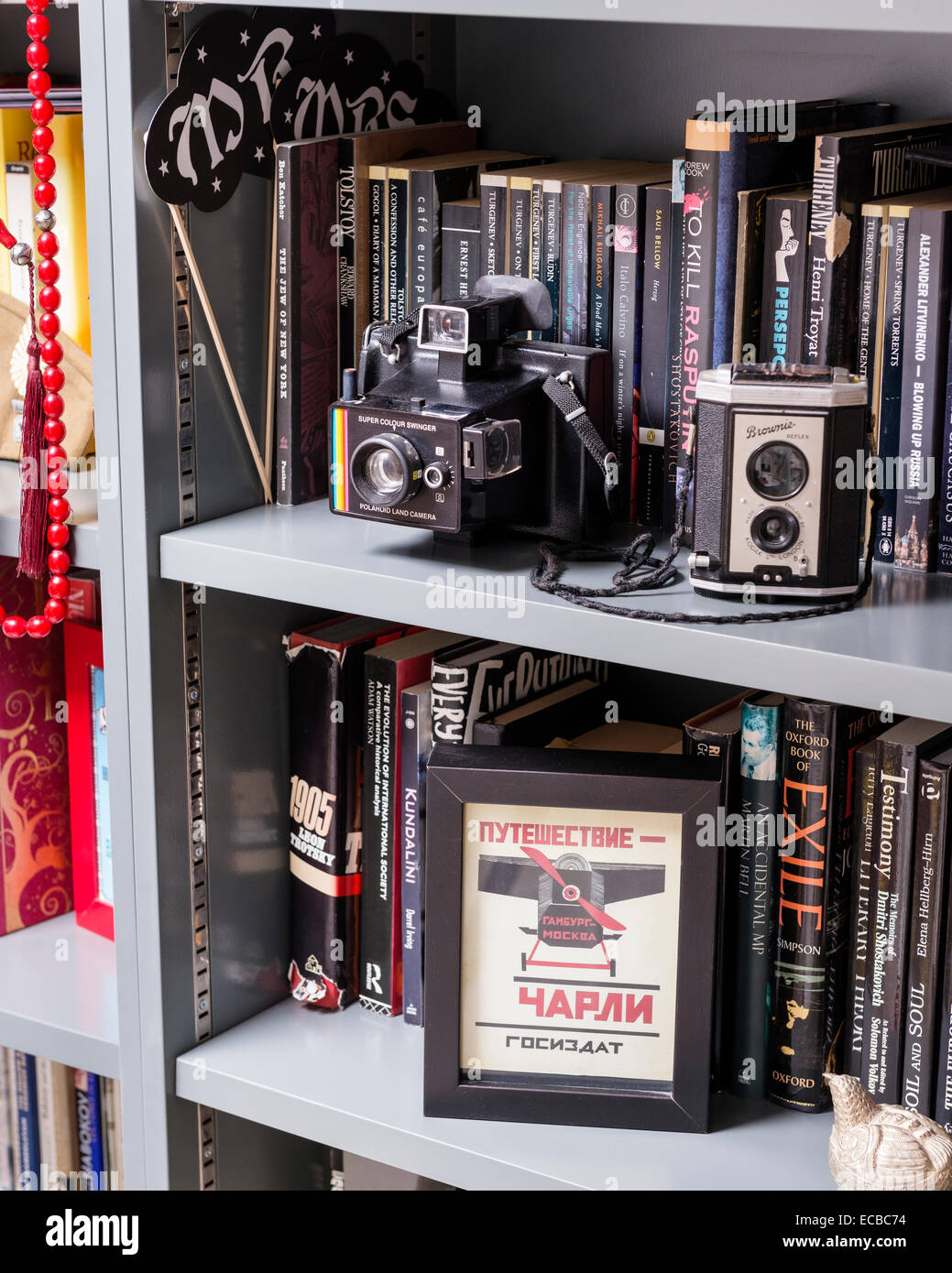 Vintage cameras on bookshelf Stock Photo