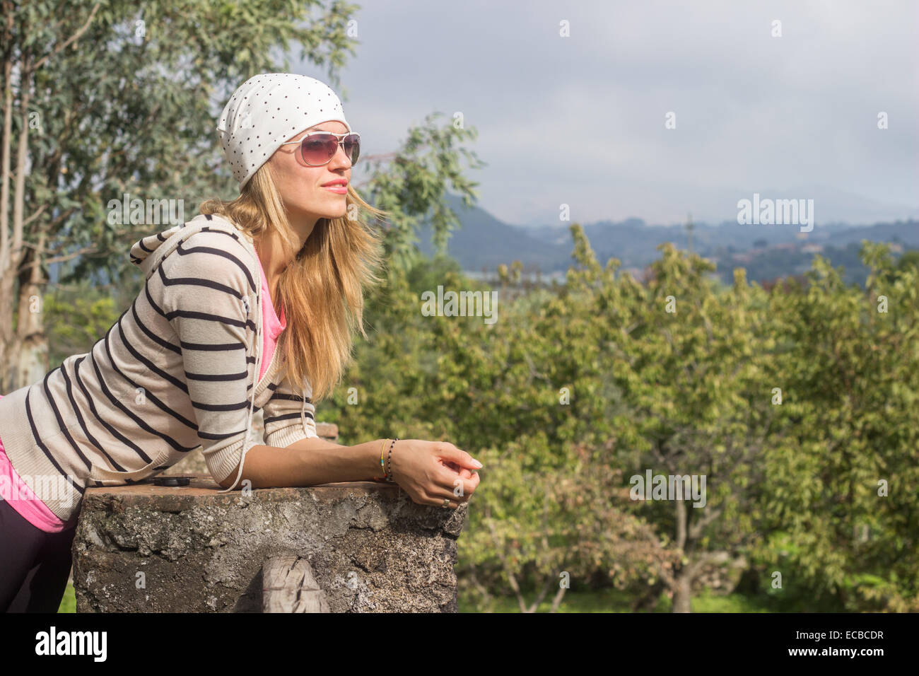 young woman relaxing spring day outdoors vacation enjoying looking 'copy space' Stock Photo