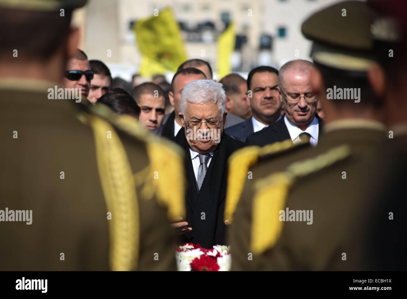 (141211) -- RAMALLAH, Dec. 11, 2014 (Xinhua) -- Palestinian President Mahmoud Abbas, center, attends the funeral procession of the late Palestinian cabinet member Ziad Abu Ain at the Palestinian Authority headquarters in the West Bank city of Ramallah on Dec. 11, 2014.(Xinhua/Fadi Arouri) Stock Photo