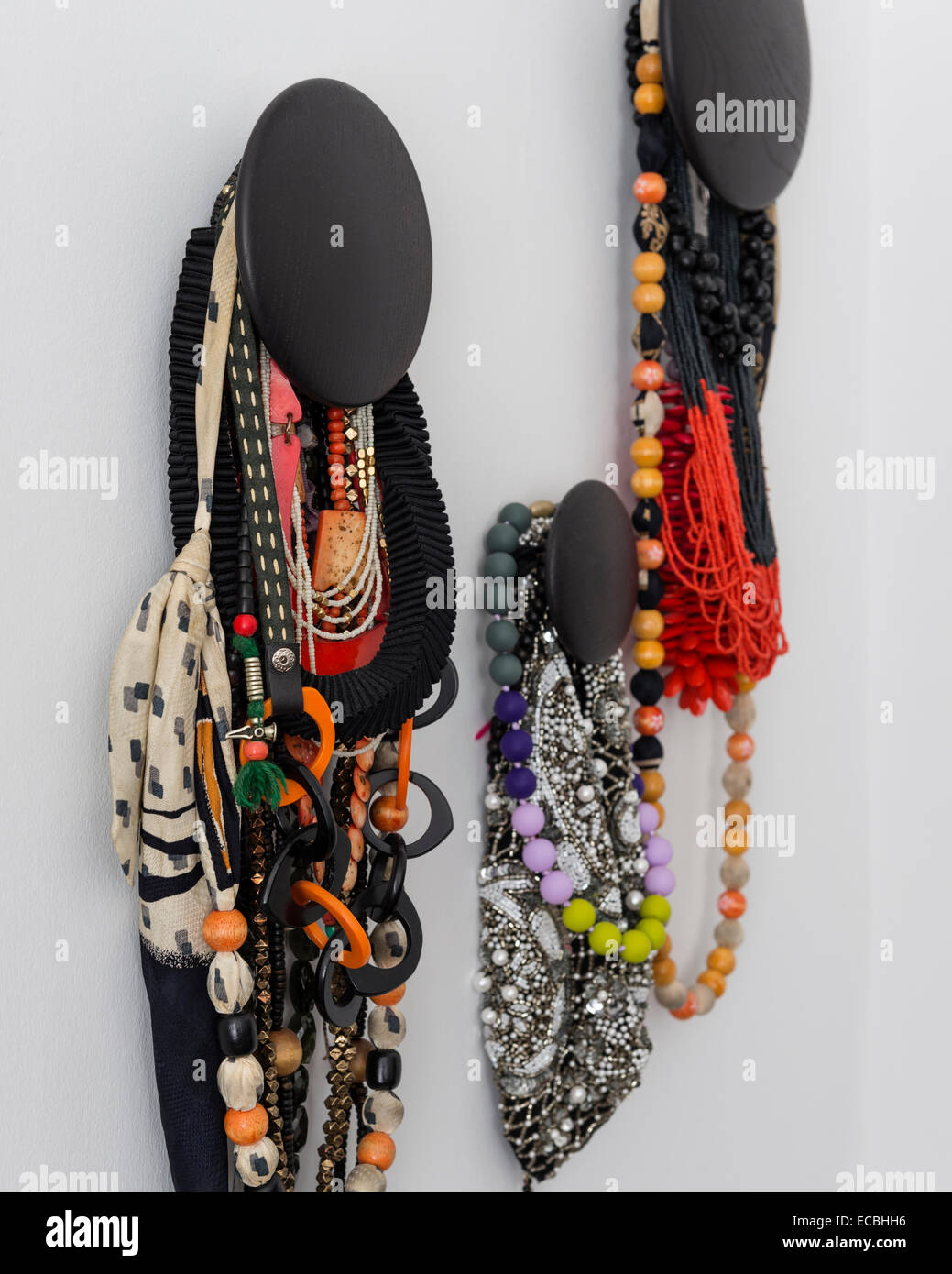 Beaded necklaces hung from the wall Stock Photo