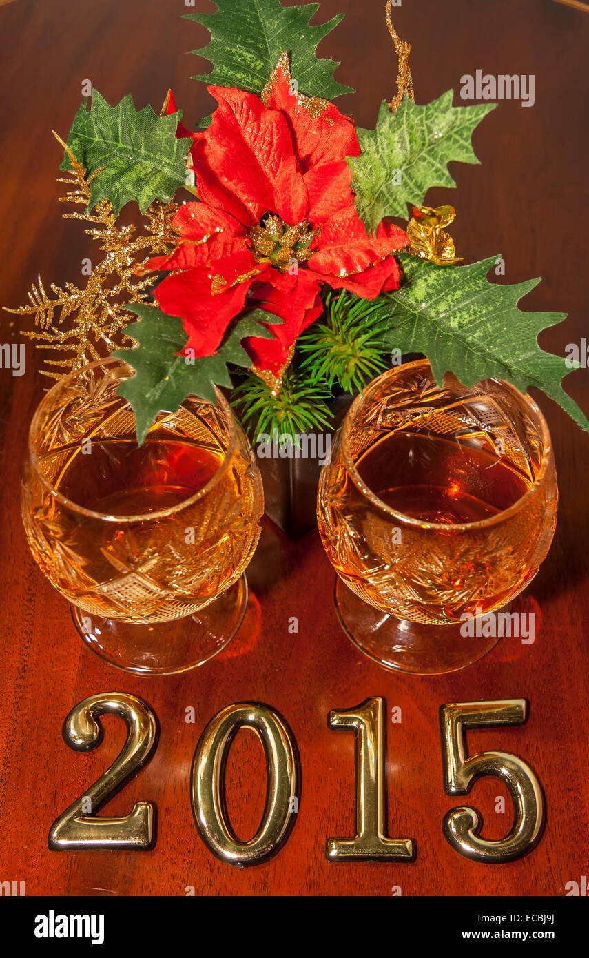 2015 New year text and two glasses of cognac with christmas star Stock Photo