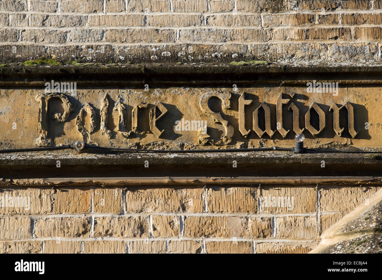 Crumbling Police station stone carving in Stow on the Wold, Cotswolds, Gloucestershire, England Stock Photo