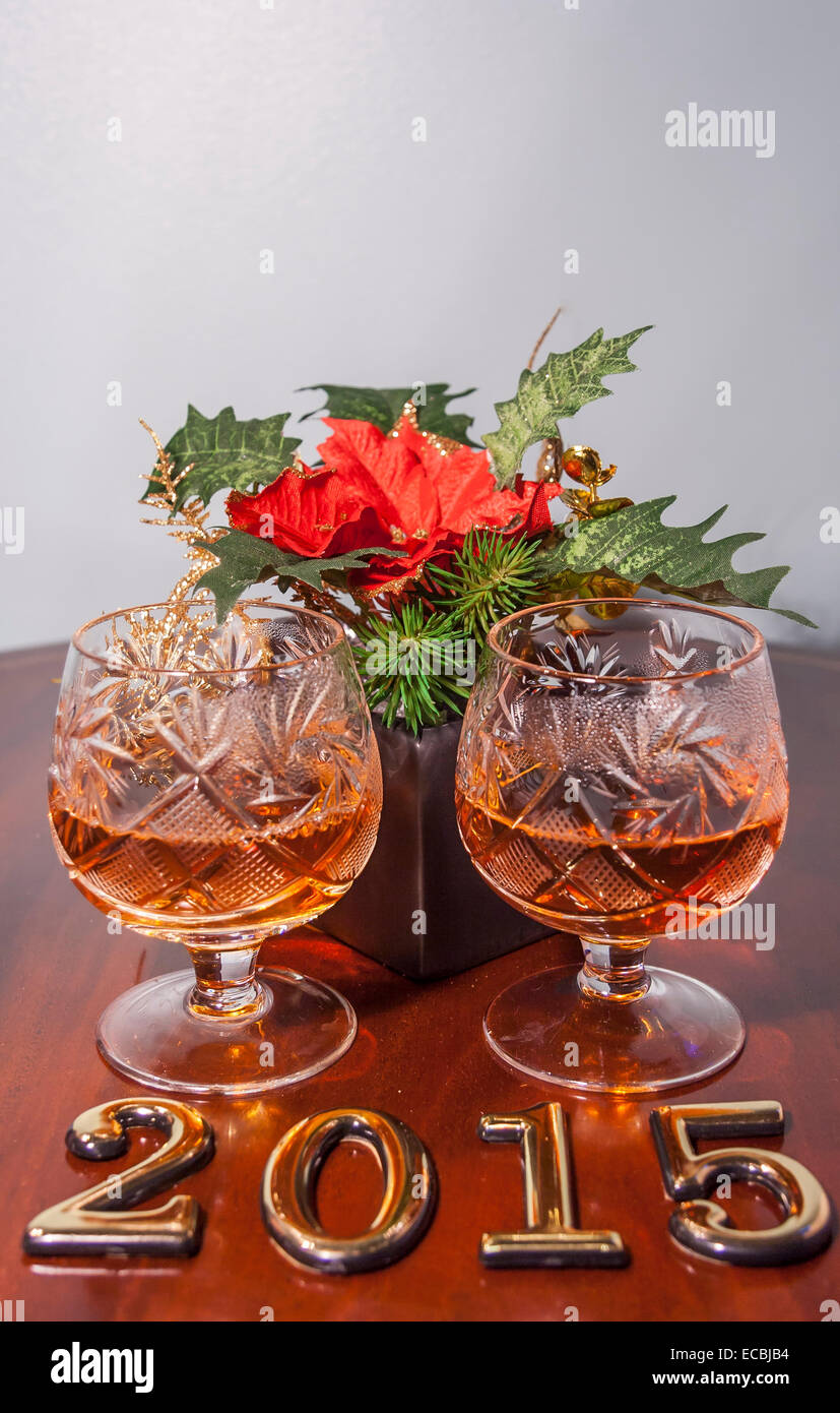 2015 New year text and two glasses of cognac with christmas star Stock Photo