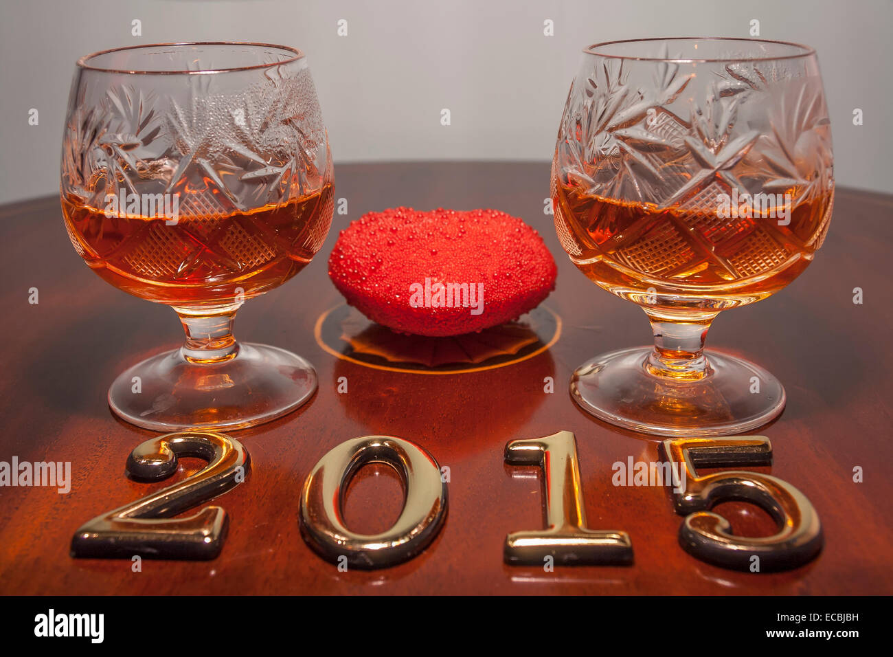 Gold 2015 New year text and two glasses of cognac Stock Photo