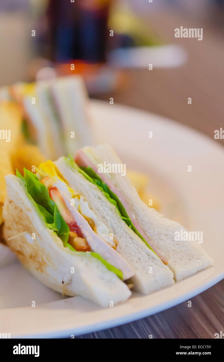 Delicious club sandwich with french fries at a dinner Stock Photo