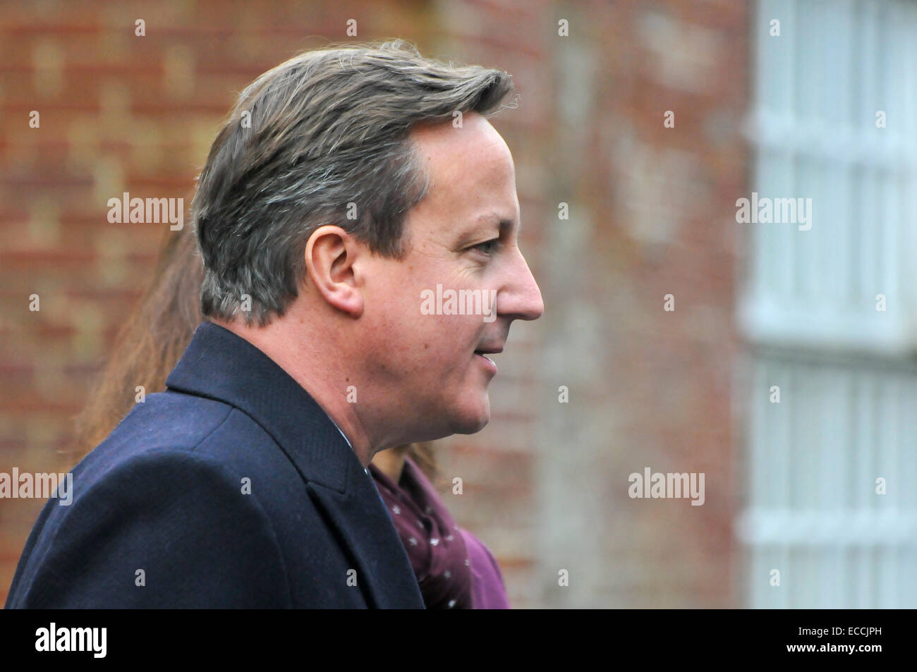 Belfast, Northern Ireland, UK. 11th December, 2014. Prime Minister David Cameron gives a brief statement to the waiting media in Belfast as he arrives for crucial cross-party talks to try to break the stalemate within the Stormont Assembly.  It is believed that if an agreement cannot be met that the Stormont Assembly will collapse. Credit:  Stephen Barnes/Alamy Live News Stock Photo