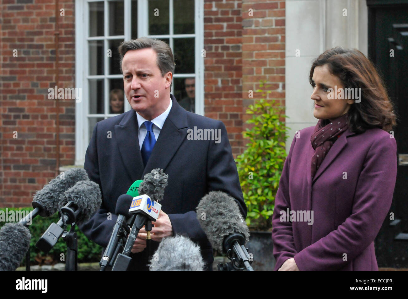 Belfast, Northern Ireland, UK. 11th December, 2014. Prime Minister David Cameron gives a brief statement to the waiting media in Belfast as he arrives for crucial cross-party talks to try to break the stalemate within the Stormont Assembly.  It is believed that if an agreement cannot be met that the Stormont Assembly will collapse. Credit:  Stephen Barnes/Alamy Live News Stock Photo