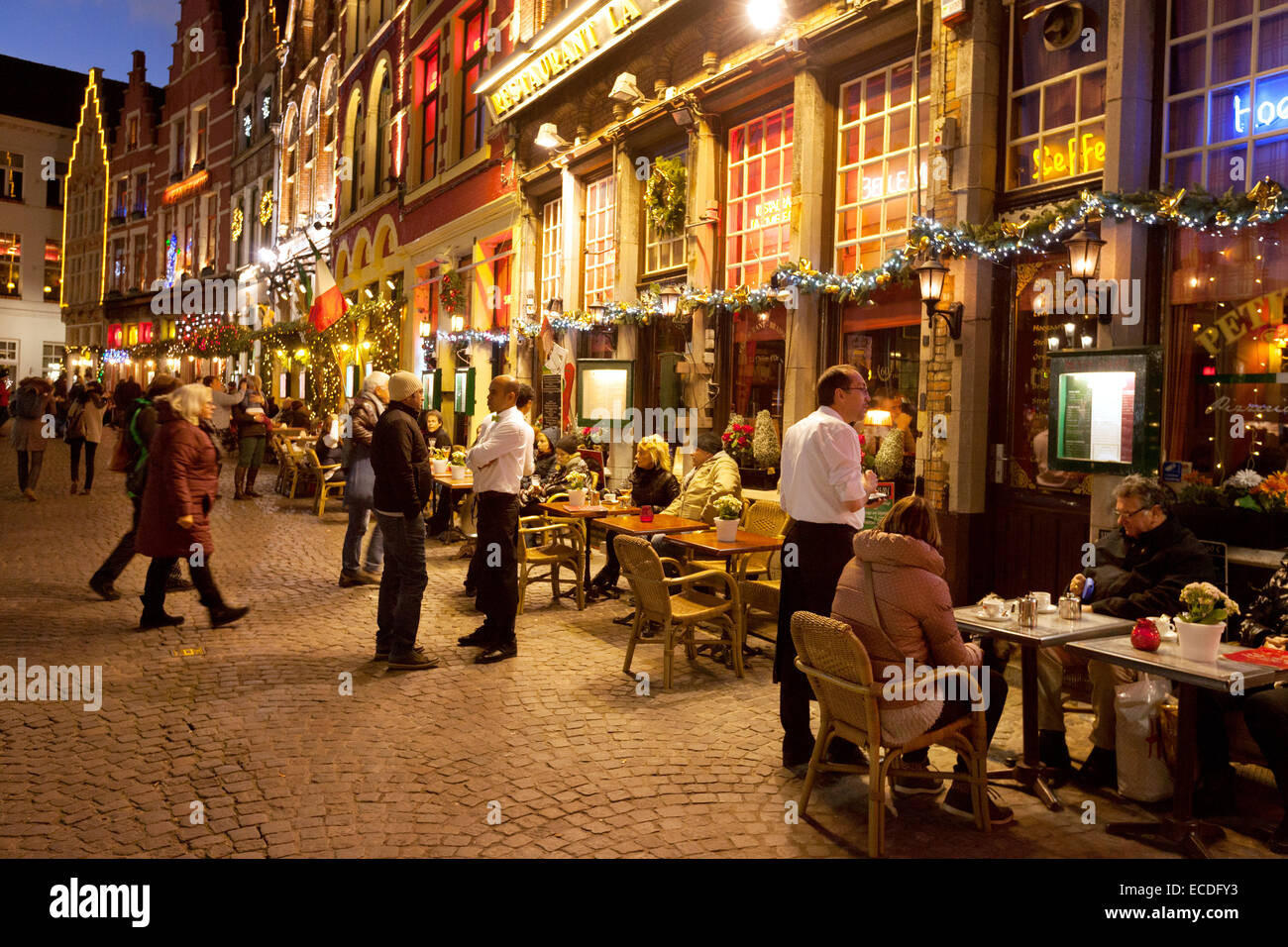 Restaurants and cafes at christmas in the Market Square ( Markt square ), city sentre, Bruges Belgium Europe Stock Photo