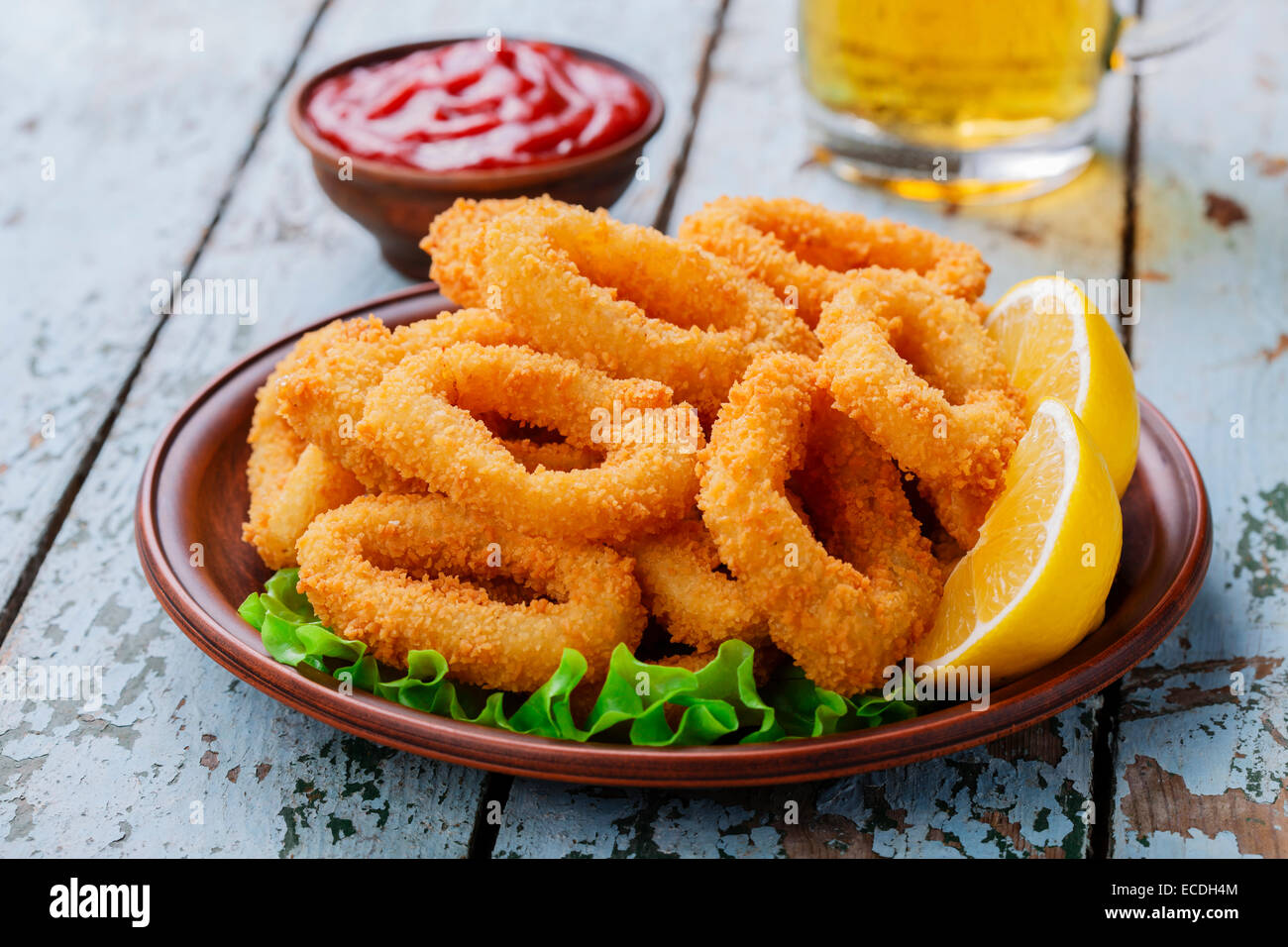 fried squid rings breaded with lemon Stock Photo