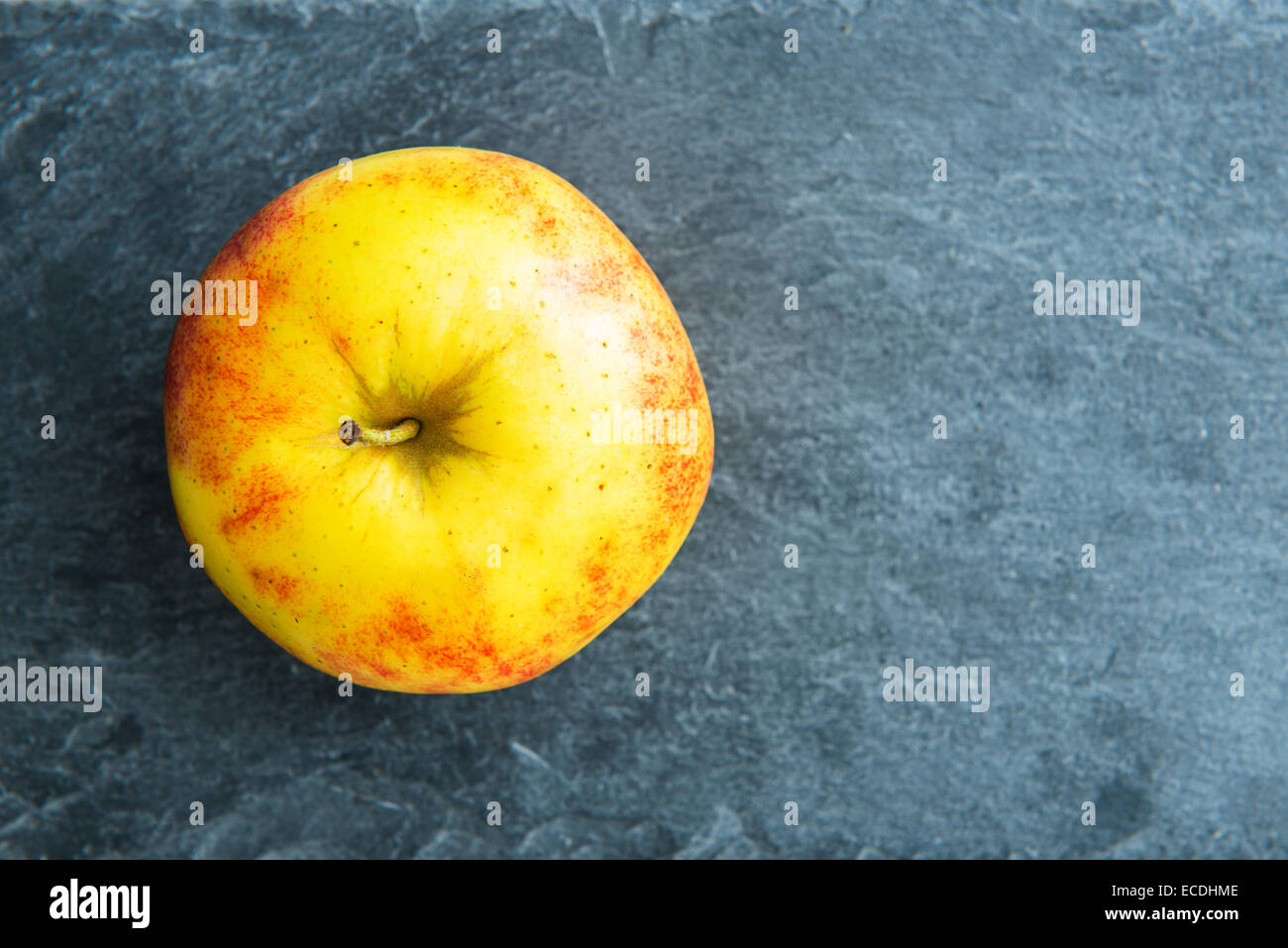 Closeup on apple on stone substrate Stock Photo