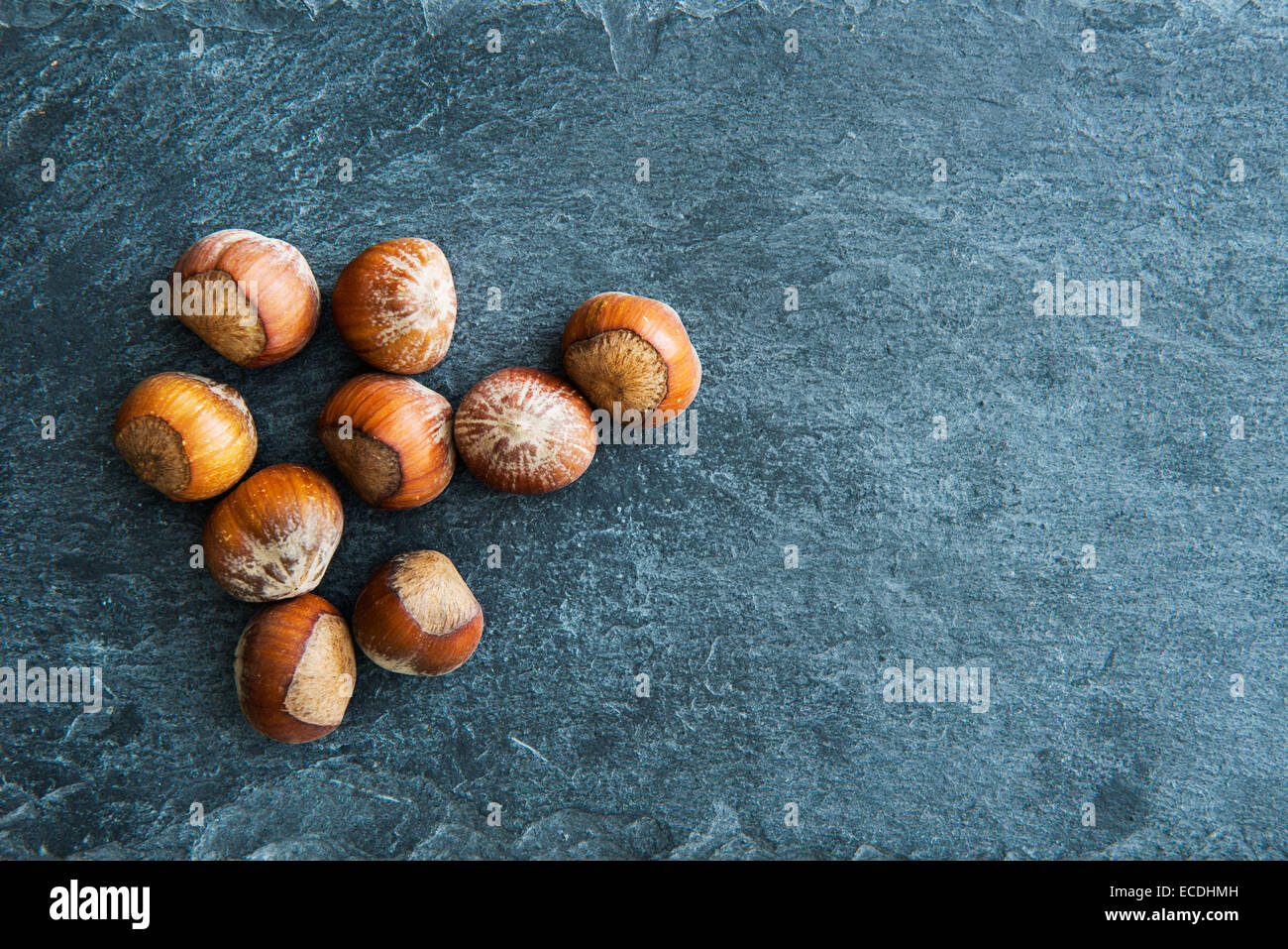Closeup on hazelnuts on stone substrate Stock Photo