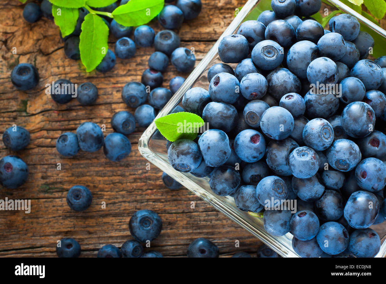 Ripe blueberries in small bowl Stock Photo