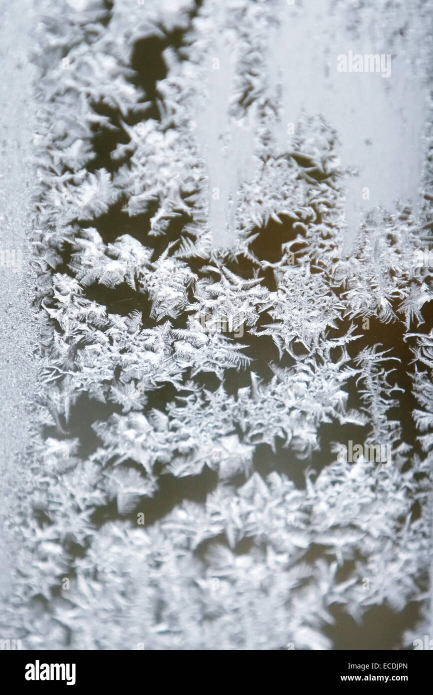 Patterns made by the hoarfrost on the window. Stock Photo