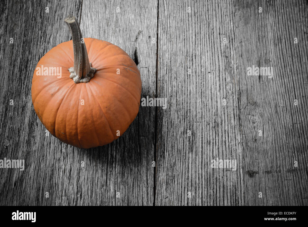 Pumpkin on Rustic Wood Background Stock Photo - Alamy