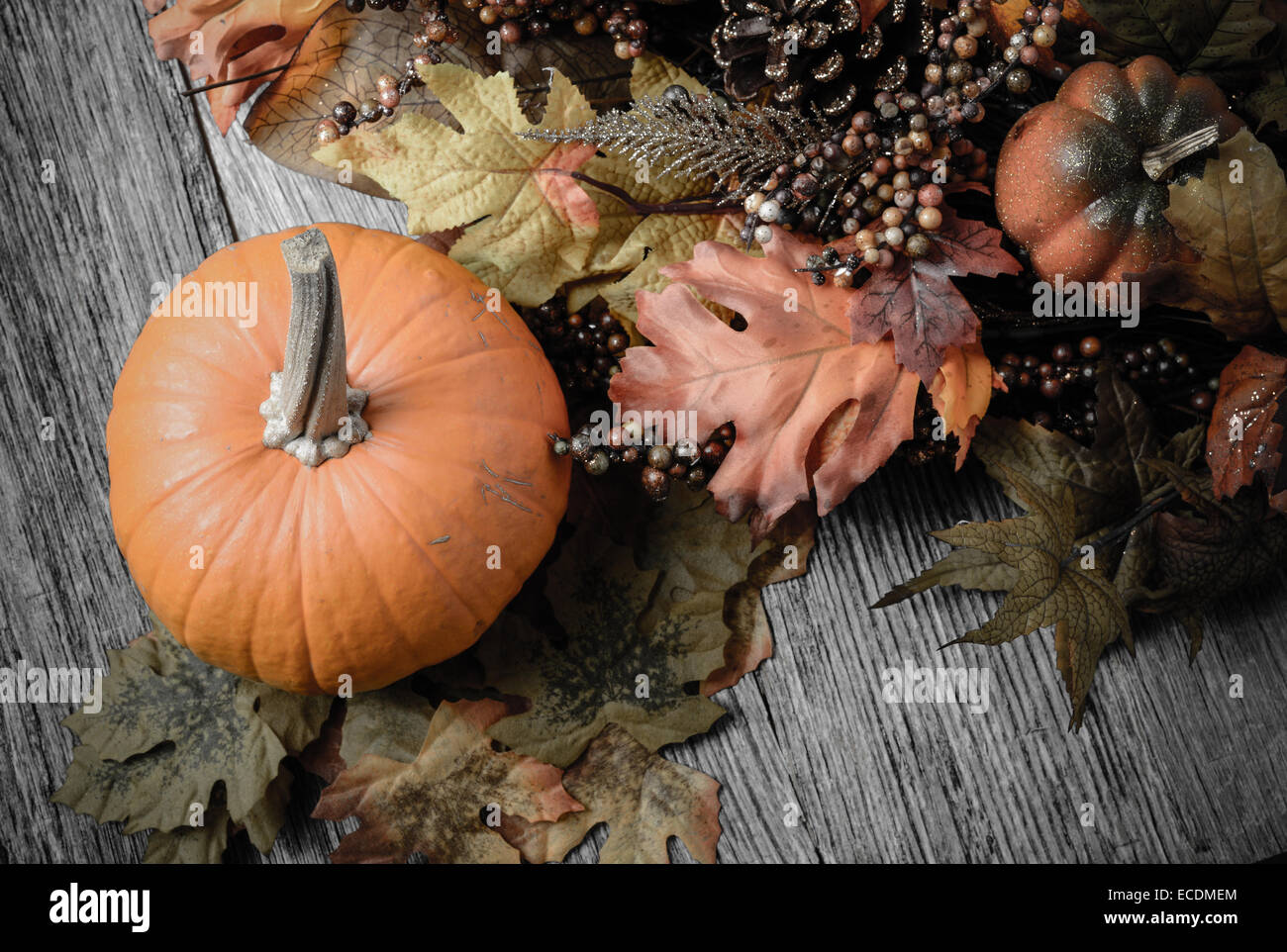 Pumpkin and Fall Leaves on Rustic Wood Background Stock Photo - Alamy