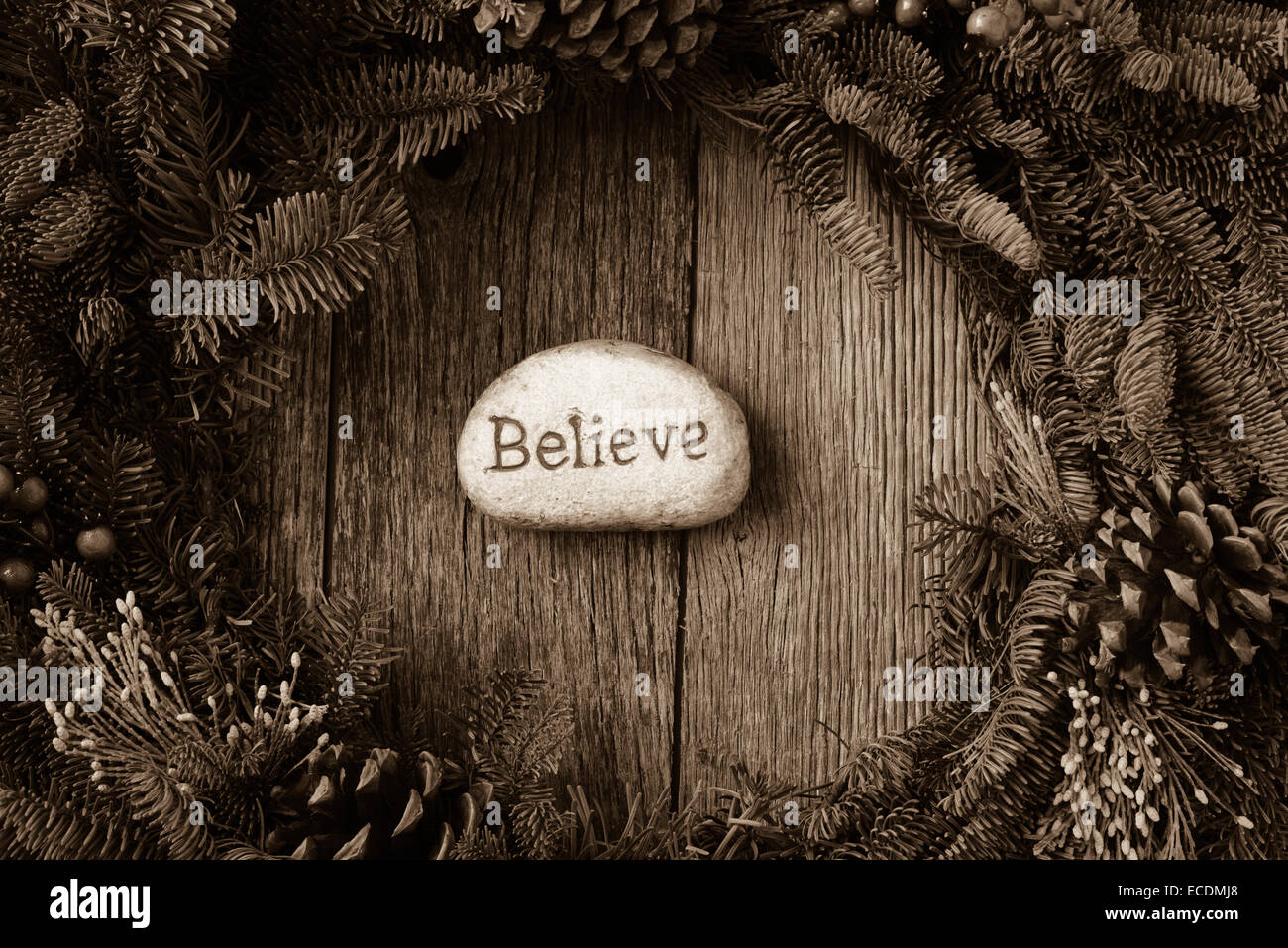 Believe in Text in the center of a Christmas Wreath Stock Photo