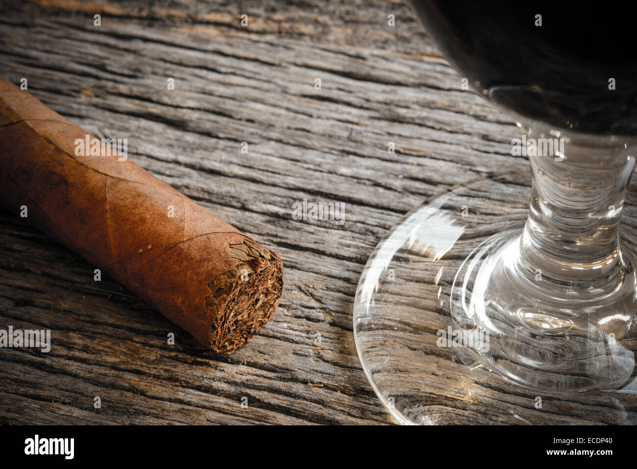 Cigar with Glass of red wine on Wooden Background Stock Photo