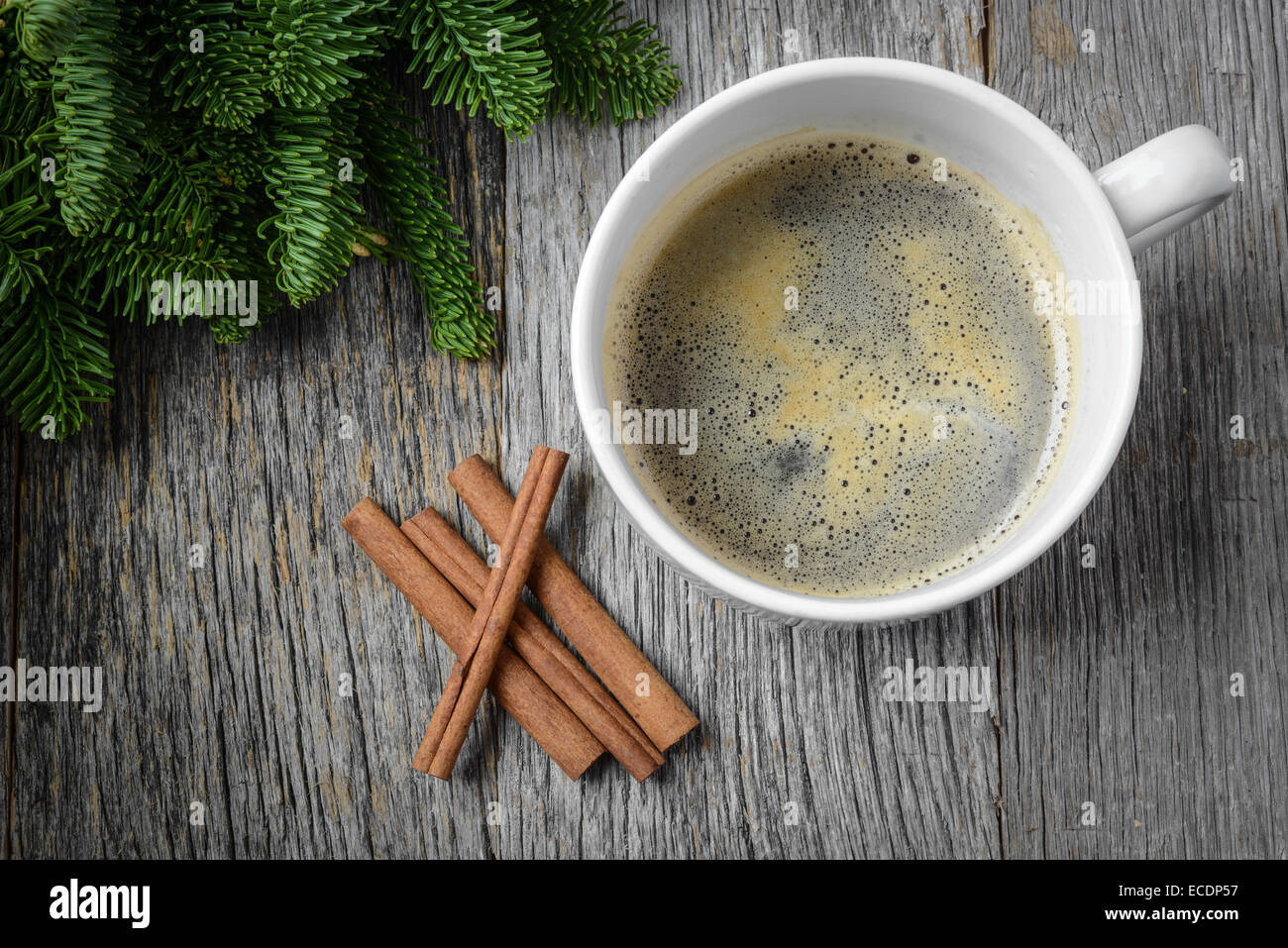 Coffee and Cinnamon for the Holidays with Christmas Pine Branch Stock Photo