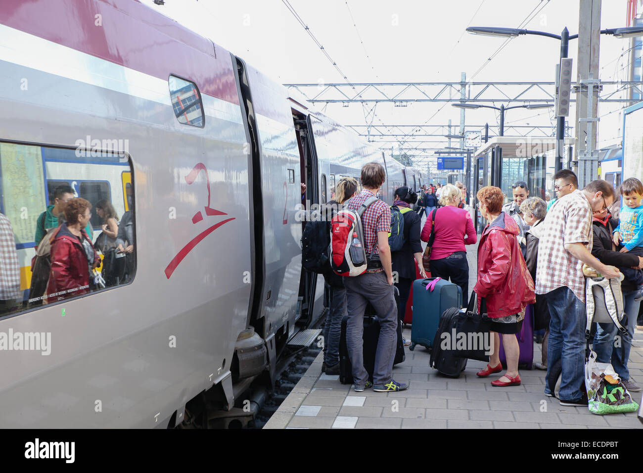 passengers boarding train Europe Stock Photo