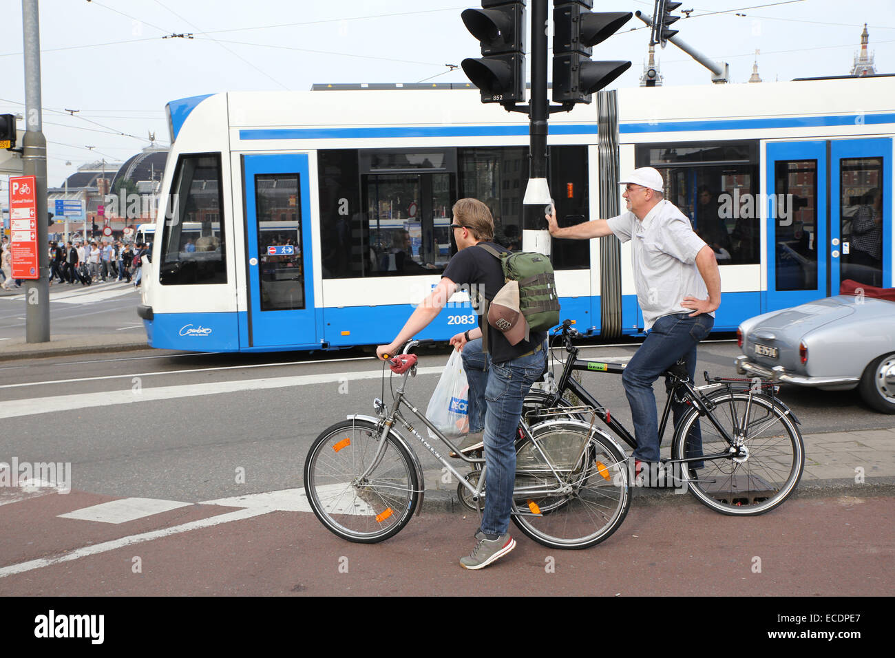 Amsterdam cyclist waiting cross road Stock Photo