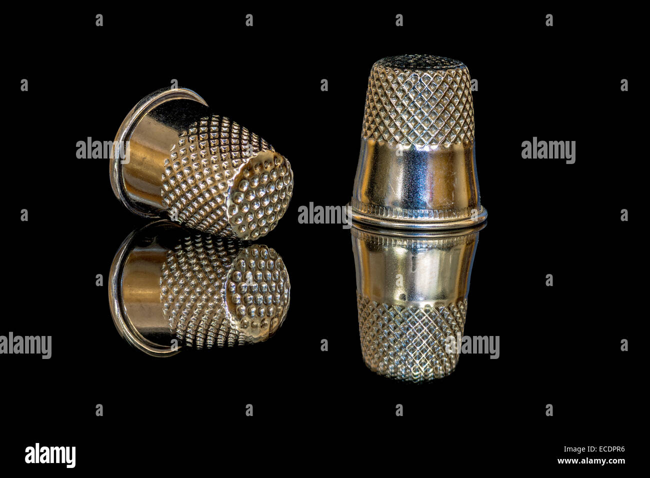 Two Thimbles with texture and reflection Stock Photo Alamy