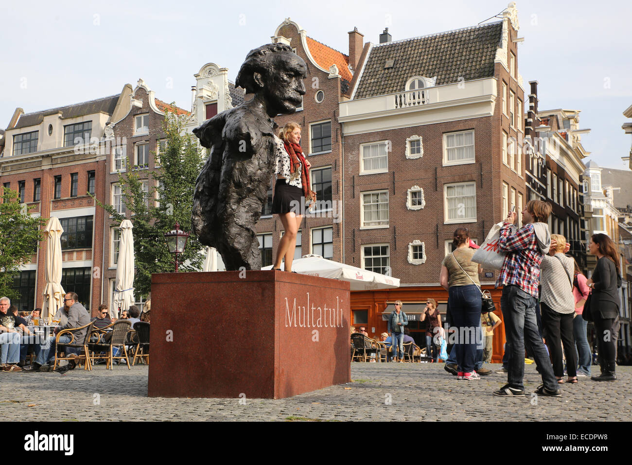 tourist taking picture statue amsterdam Stock Photo