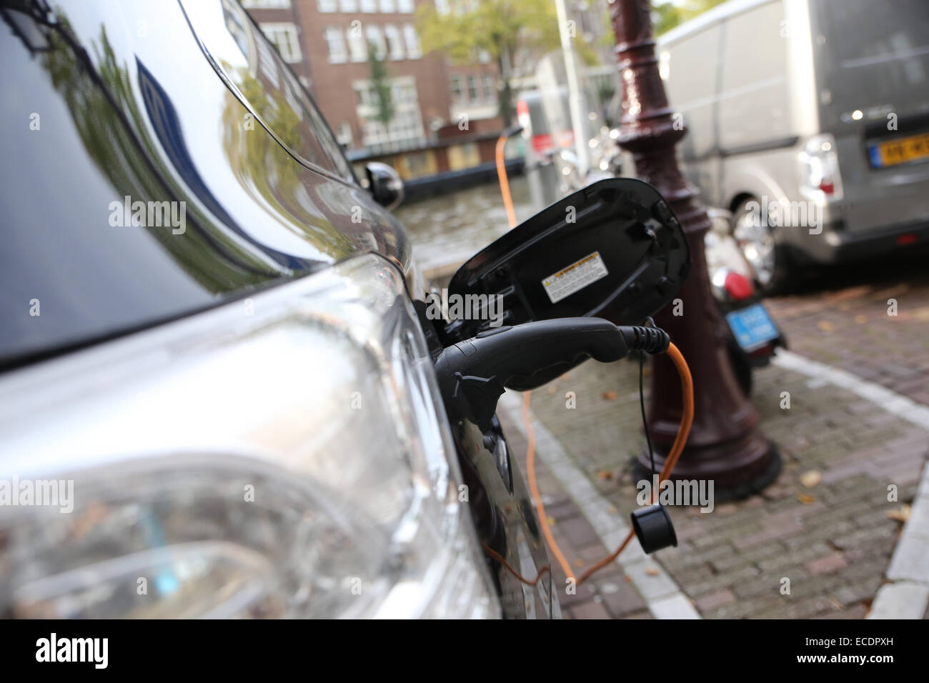 charging electric car outdoor europe Stock Photo
