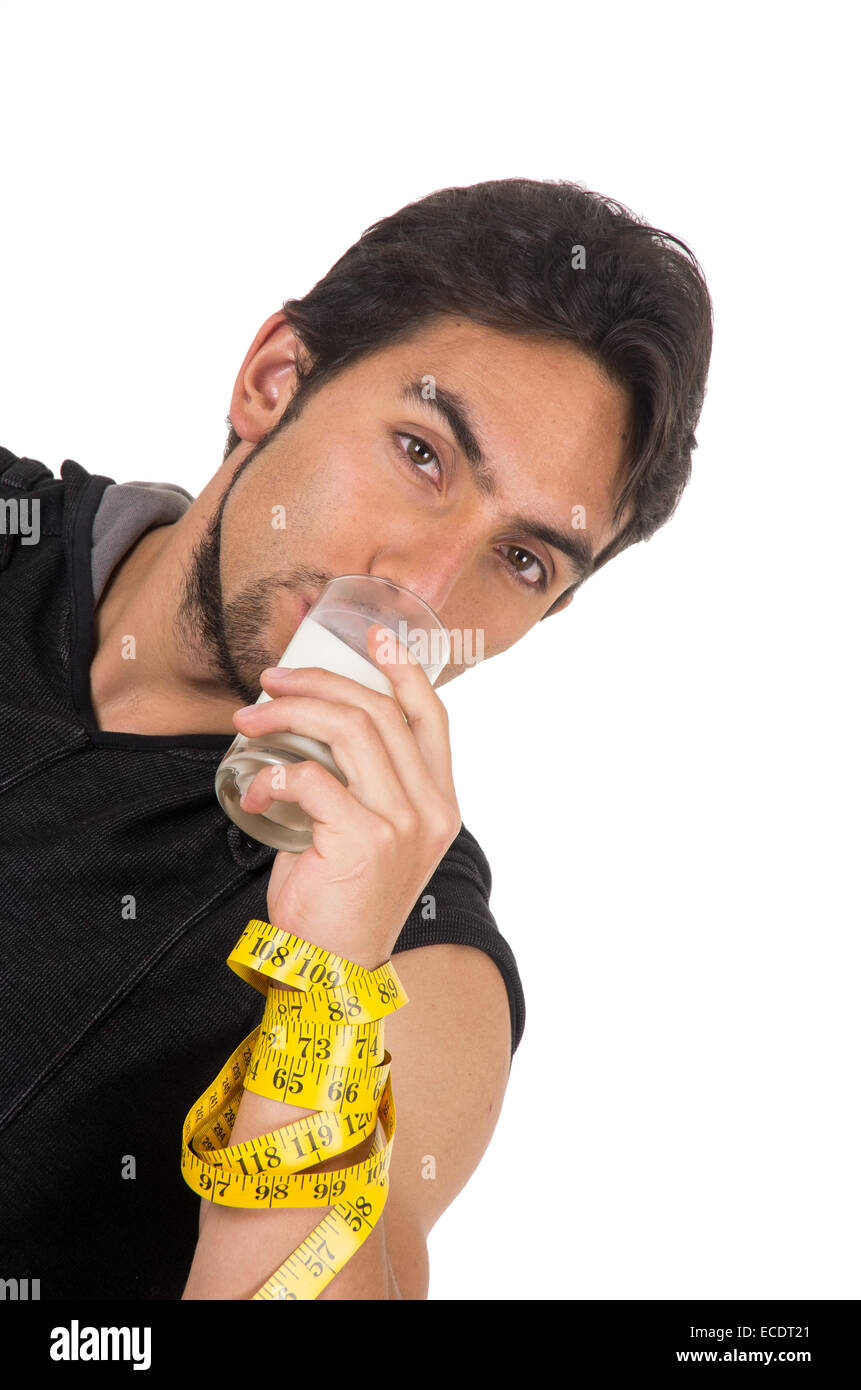 handsome athletic young man wrapped around measuring tape drinking