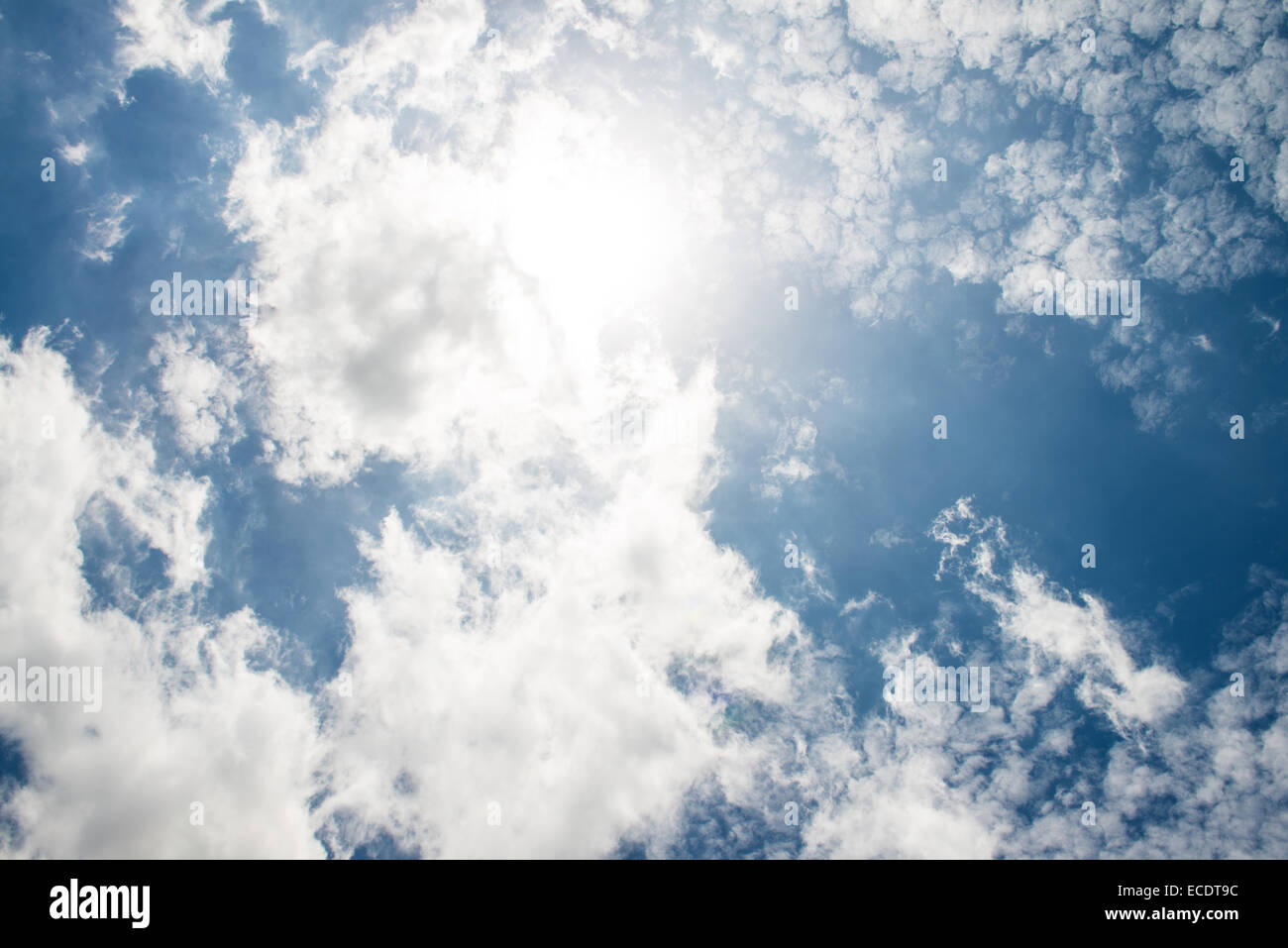 The blue sky and white fluffy clouds Stock Photo - Alamy