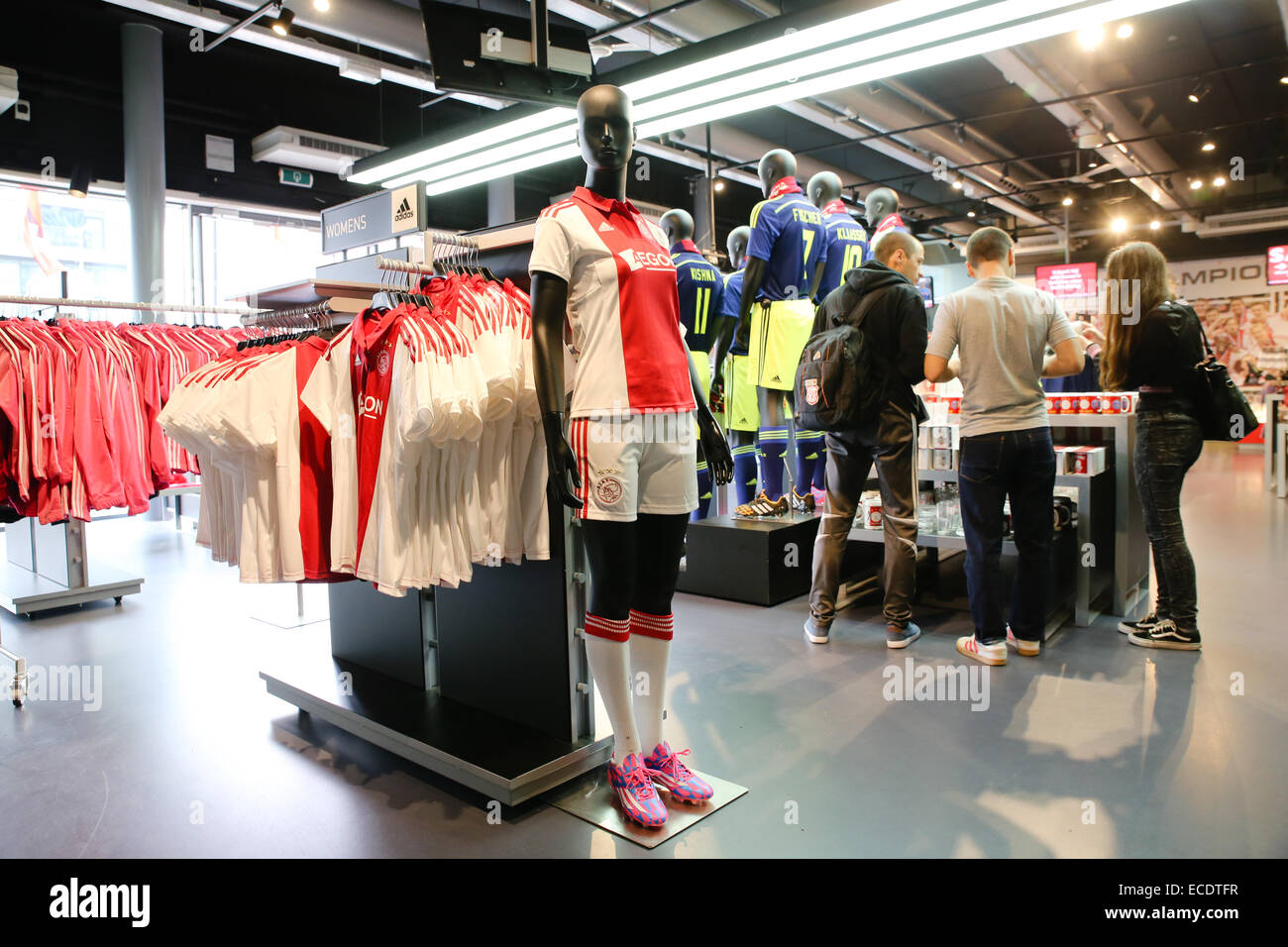 young people shopping inside soccer Amsterdam Ajax gift store Stock Photo