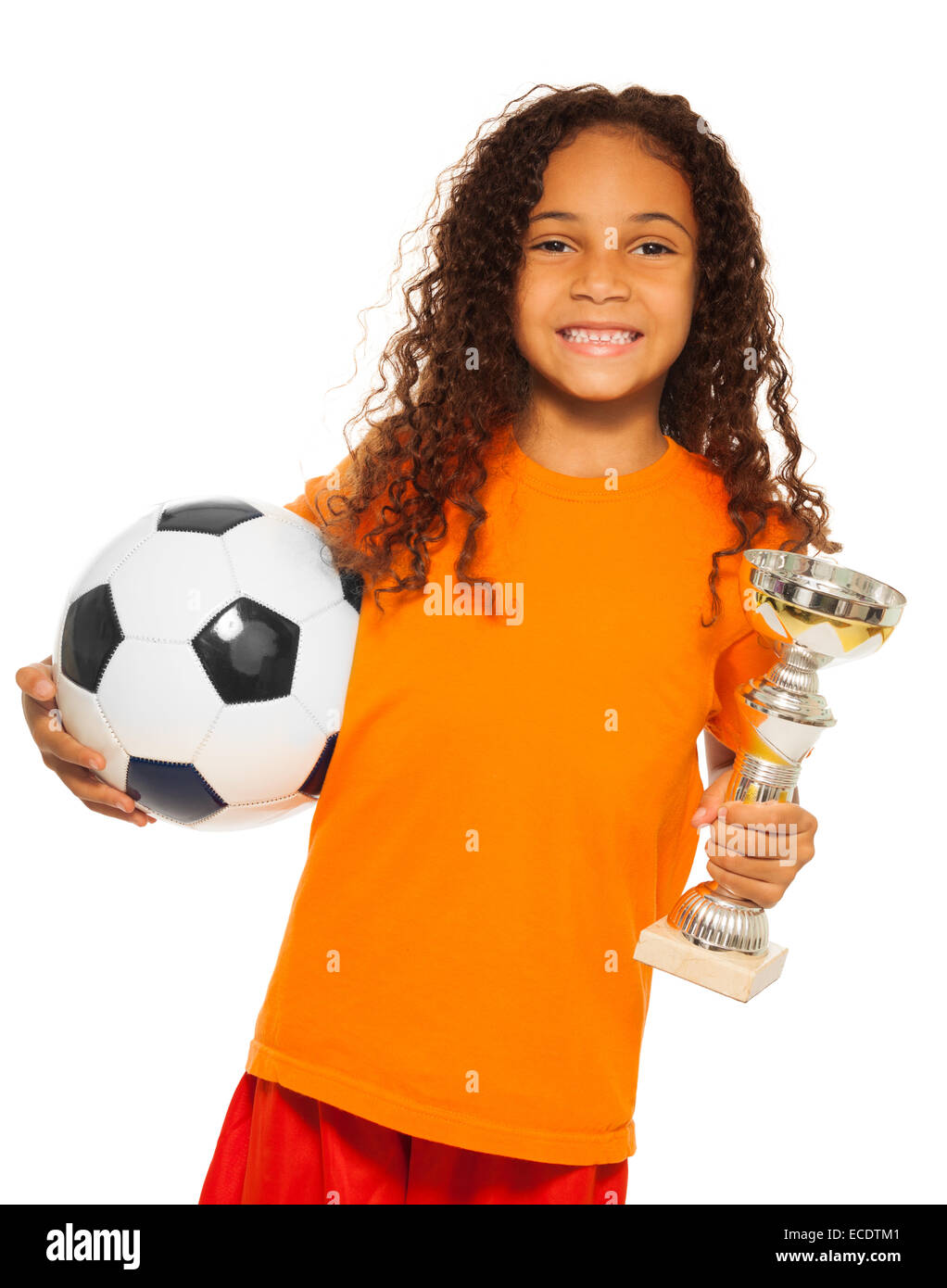 Little black girl holding soccer ball and prize Stock Photo
