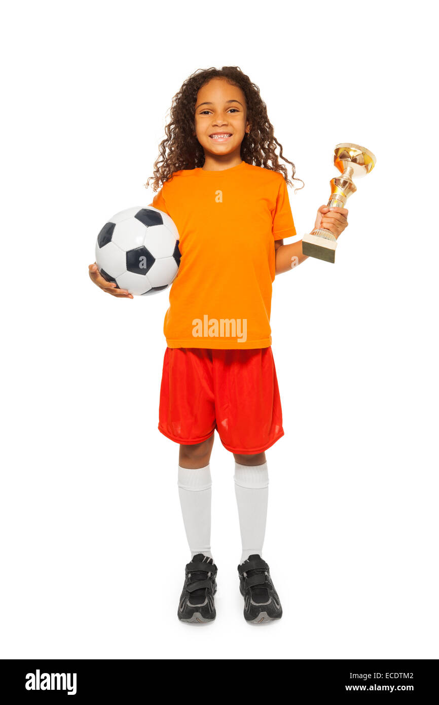 Little African girl holding soccer ball and prize Stock Photo