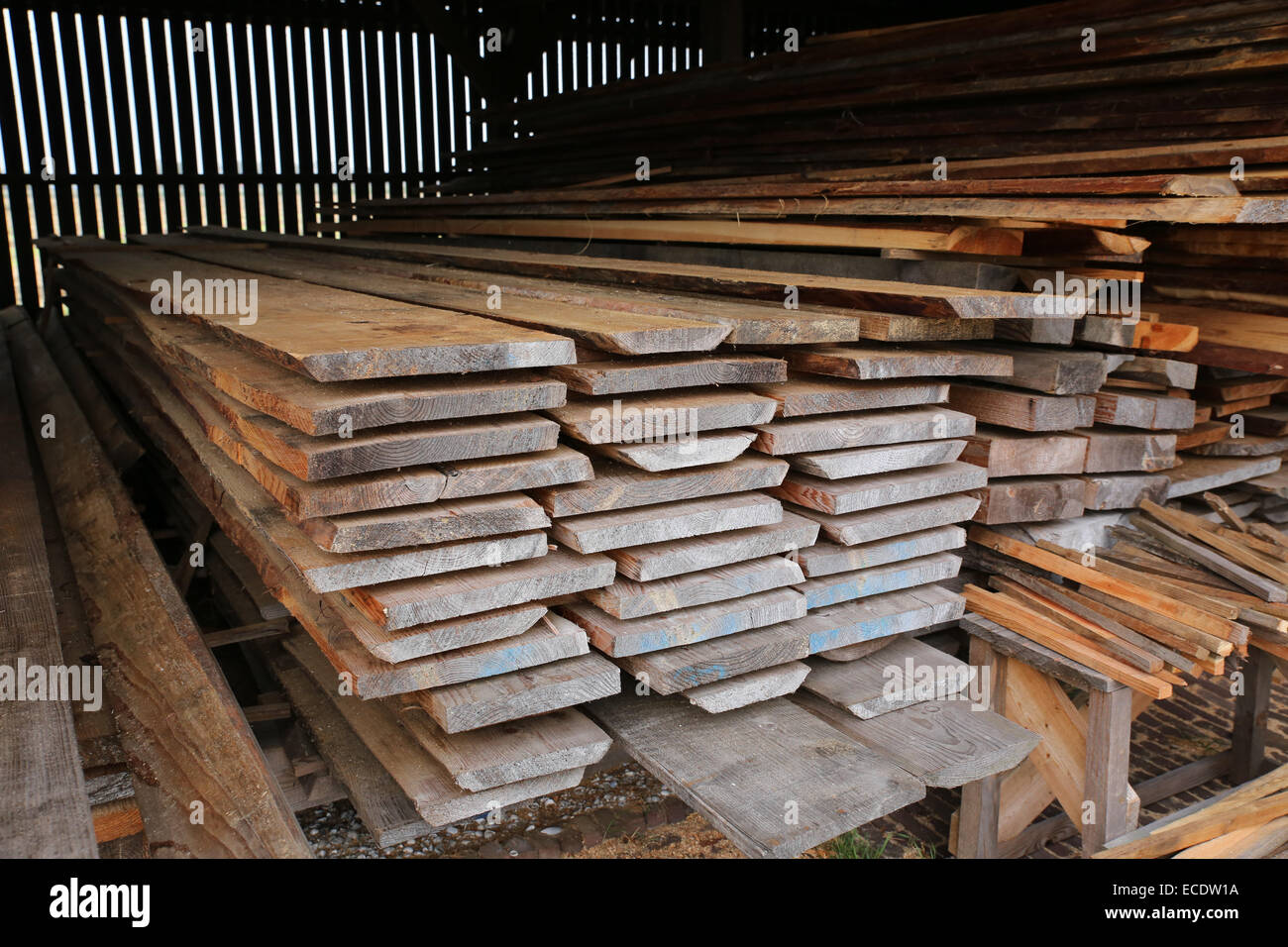 stack cut wood storage room Stock Photo