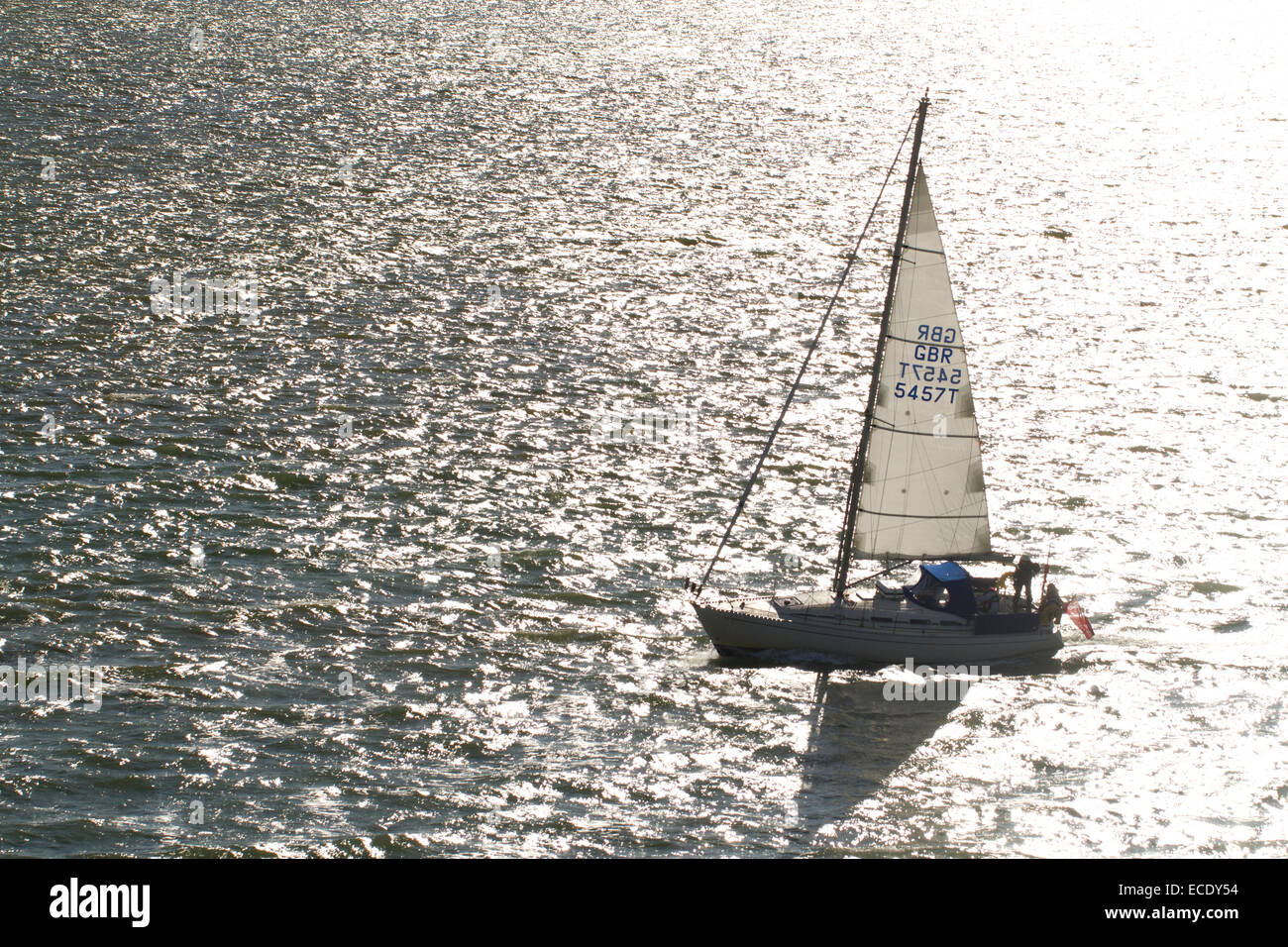Sailing yacht at sea in bright sunlight. The Solent near Portsmouth  Hampshire, England. May. Stock Photo