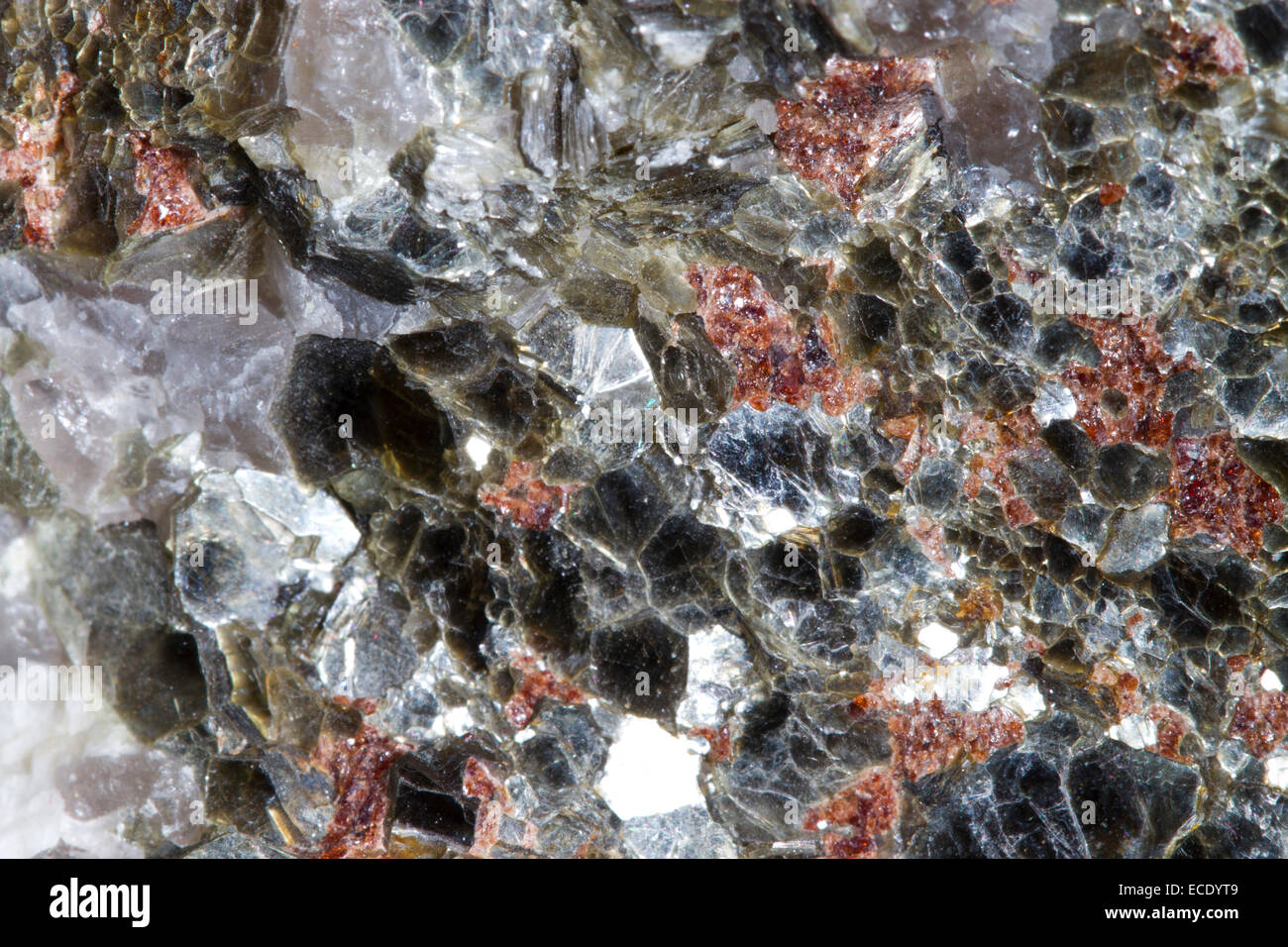 Minerals. Muscovite mica flakes, garnets, and quartz. Origin Norway. Stock Photo