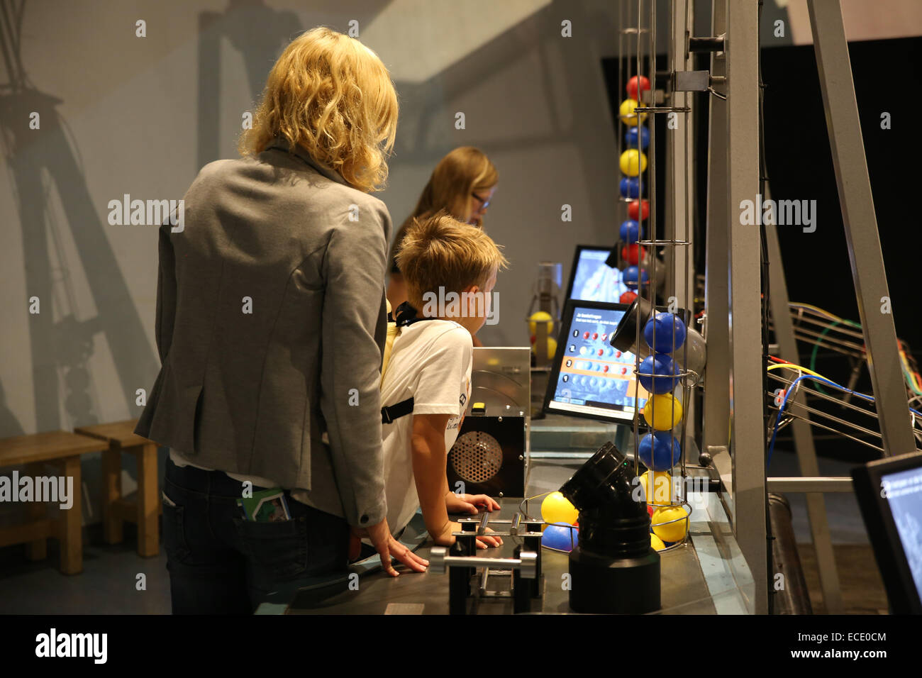 young boy watching screen inside Nemo science centre center Stock Photo
