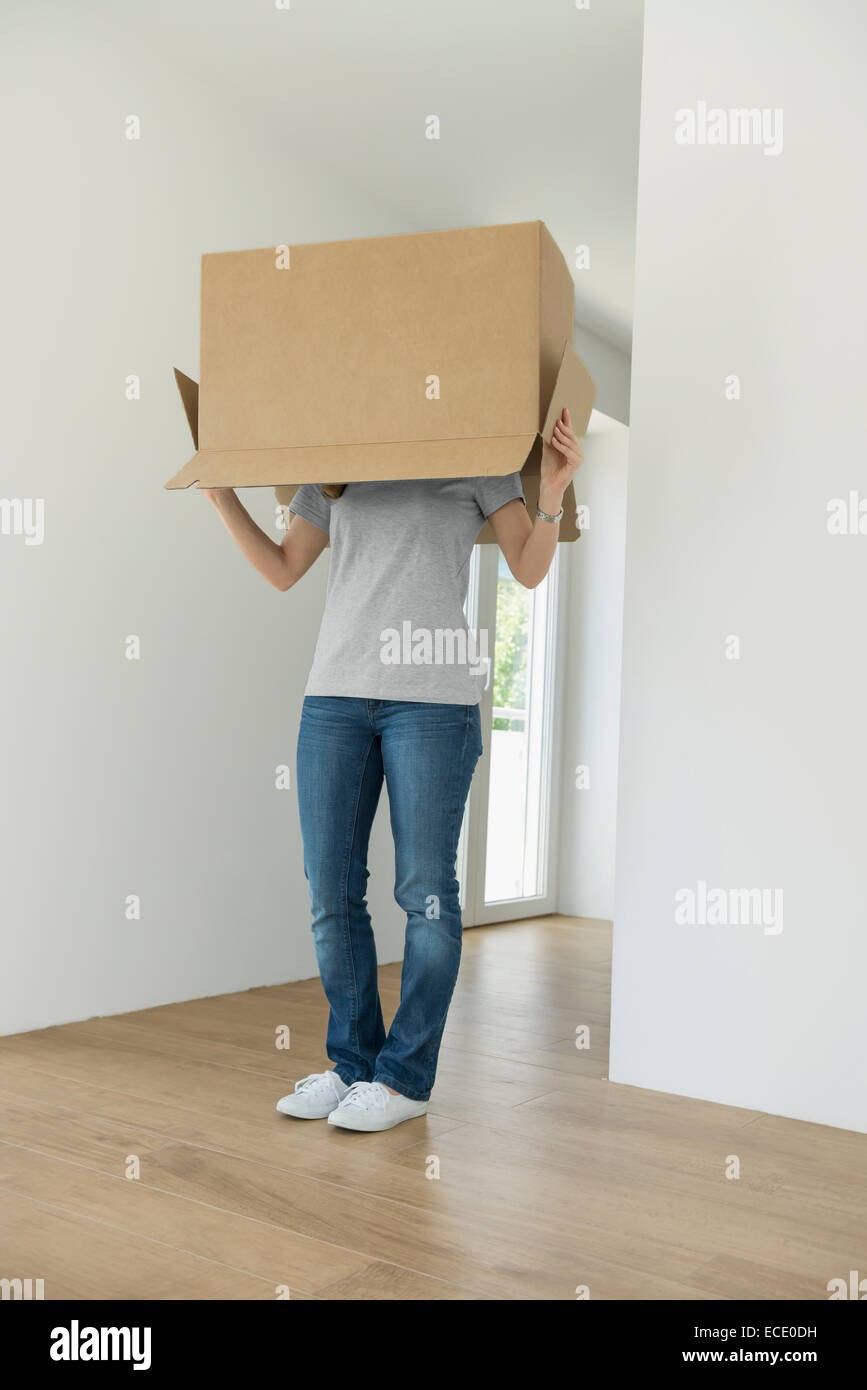 Empty room new home moving in woman Stock Photo - Alamy