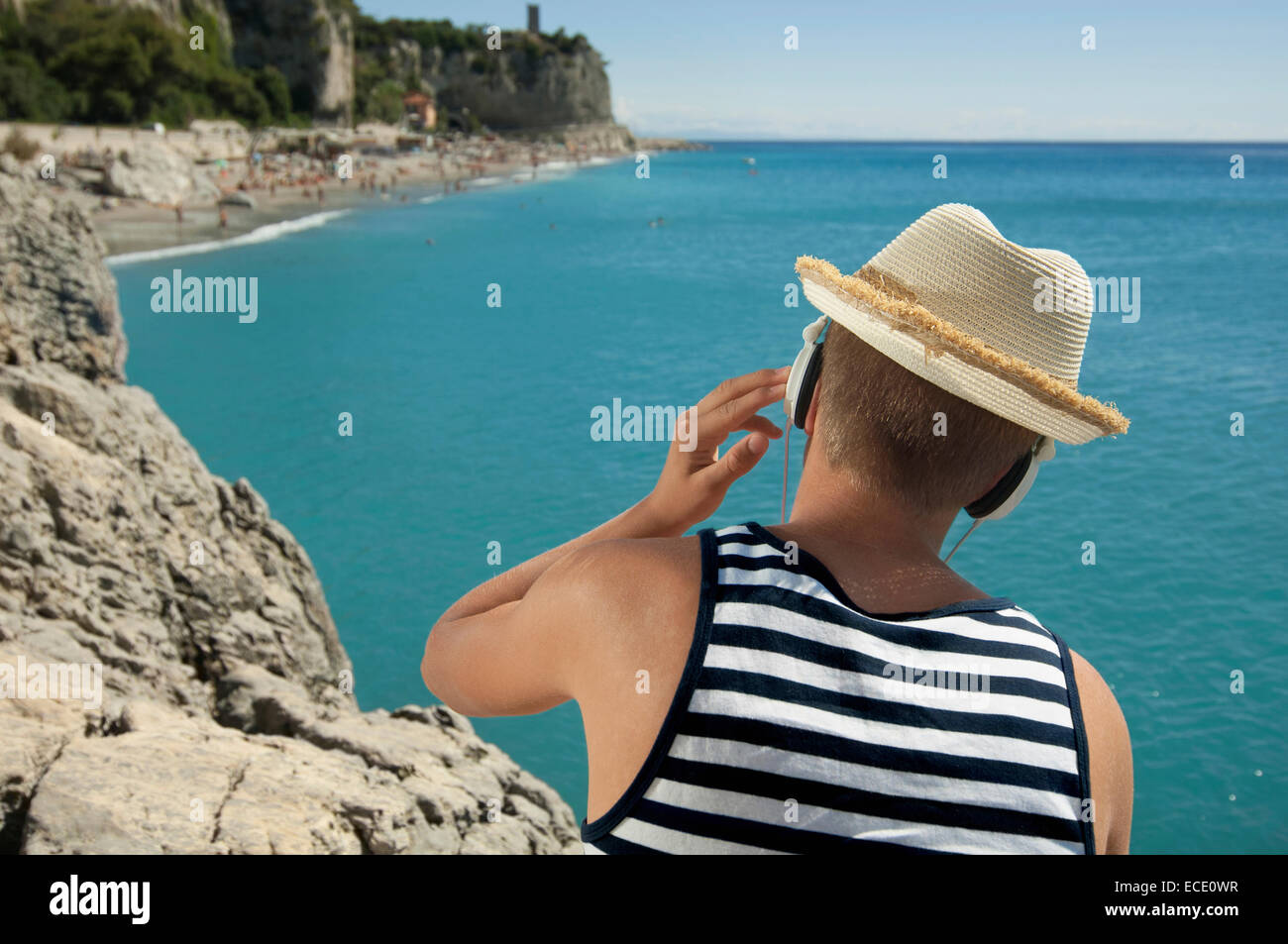 Teenager holiday summer relaxing hat headphones Stock Photo
