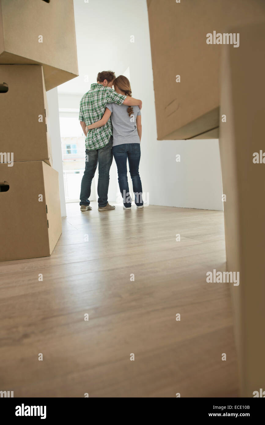 Moving out relocation couple cardboard boxes Stock Photo