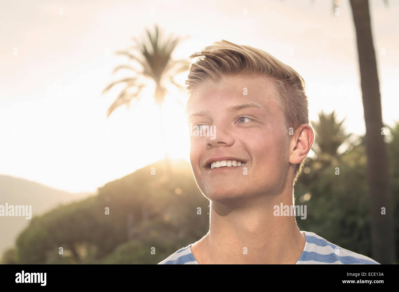 Sunset portrait young teenager smiling holiday Stock Photo