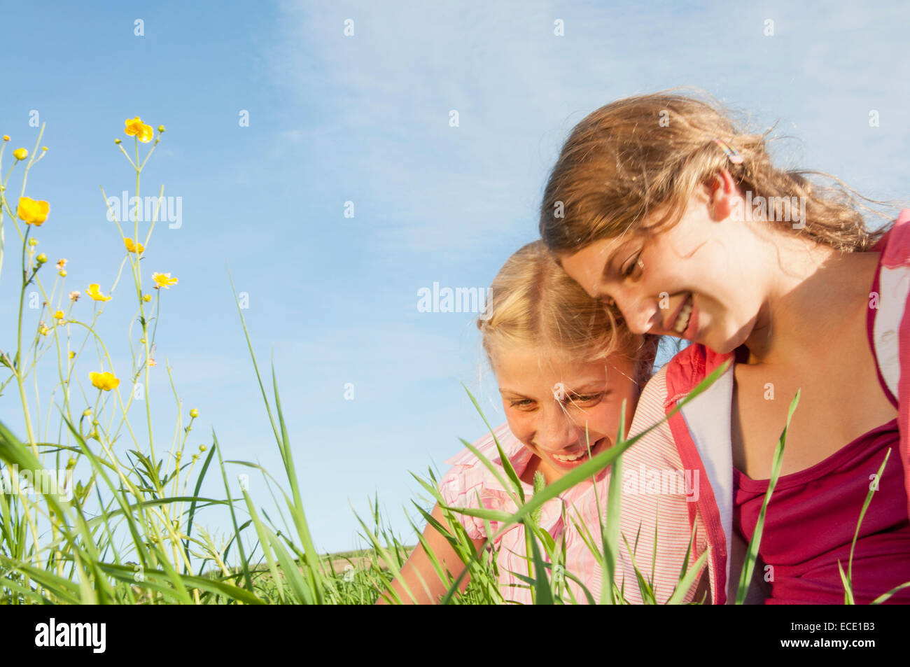 Portrait two girls field countryside happy Stock Photo - Alamy