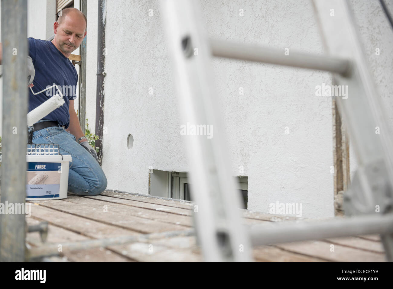 Man working repairing renovating exterior wall Stock Photo Alamy