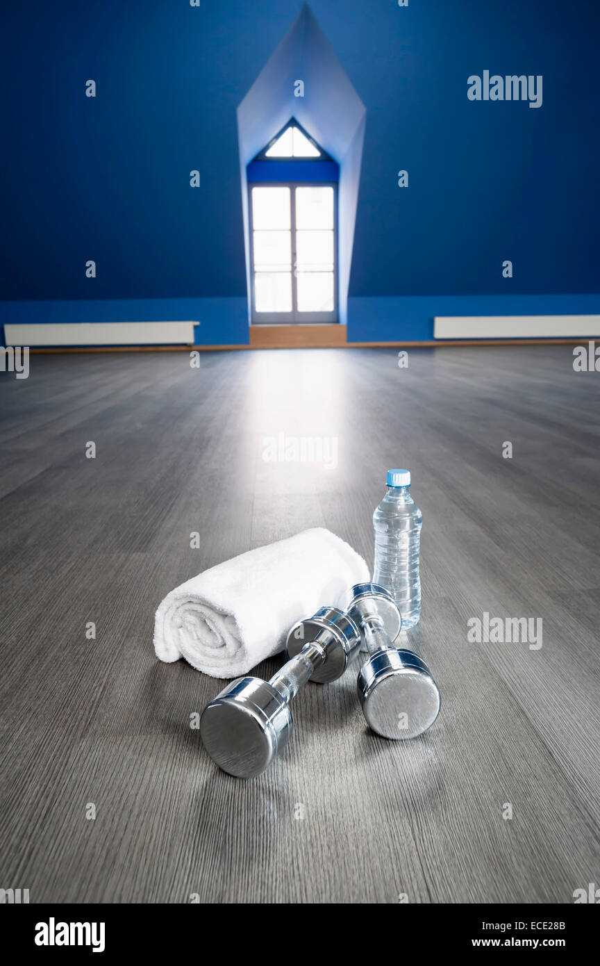 Empty fitness training room towel barbell water Stock Photo