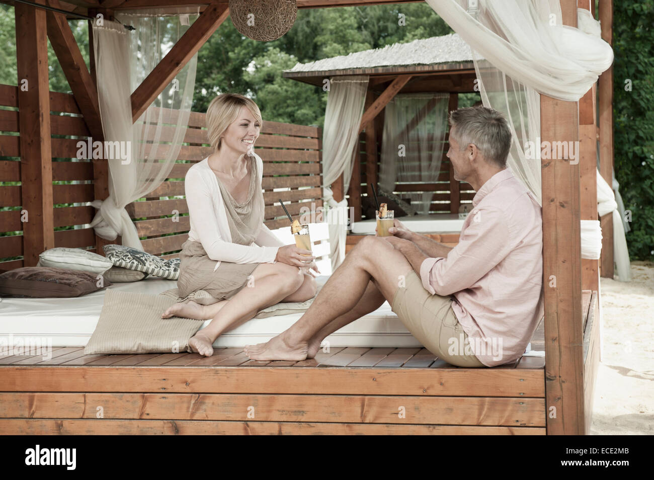 Couple sitting across from each other hi-res stock photography and ...