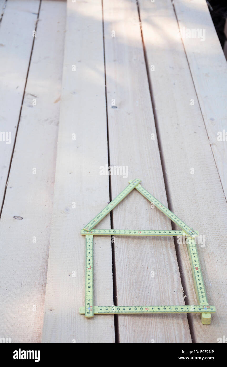 Folding Ruler Shaped As House On Wood Stock Photo Alamy folding-ruler-shaped-as-house-on-wood-stock-photo-alamy