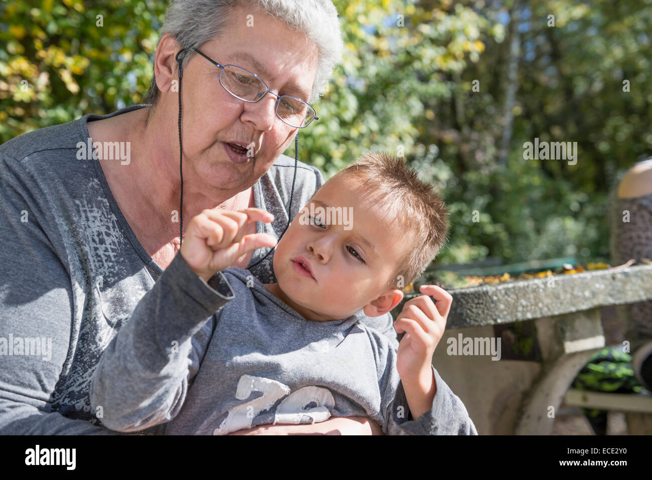 Portrait small boy sitting on grandmothers knee Stock Photo