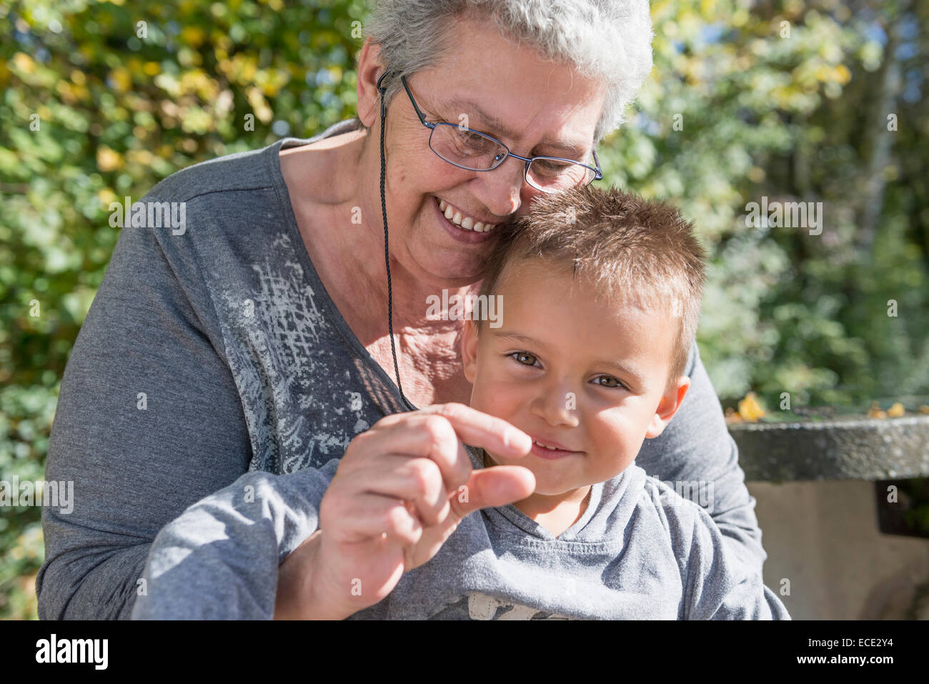 Grandmother grandson playing explaining happy Stock Photo